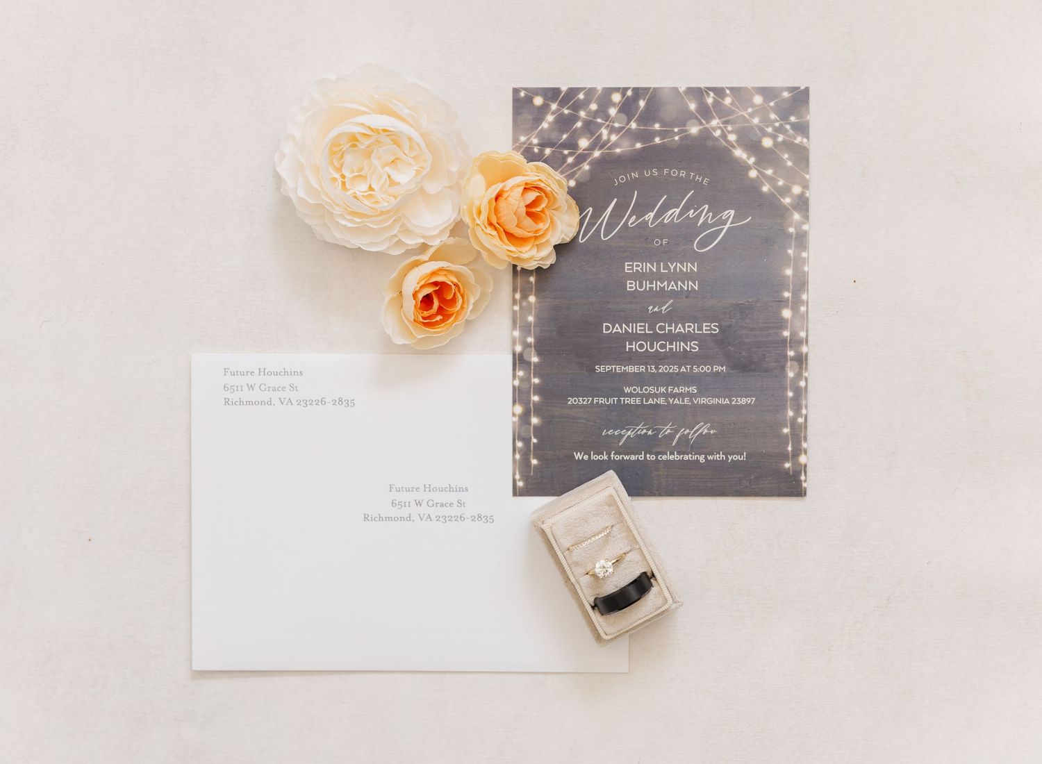 Wedding invitation suite in gray and white with peach-colored flowers and delicate details.