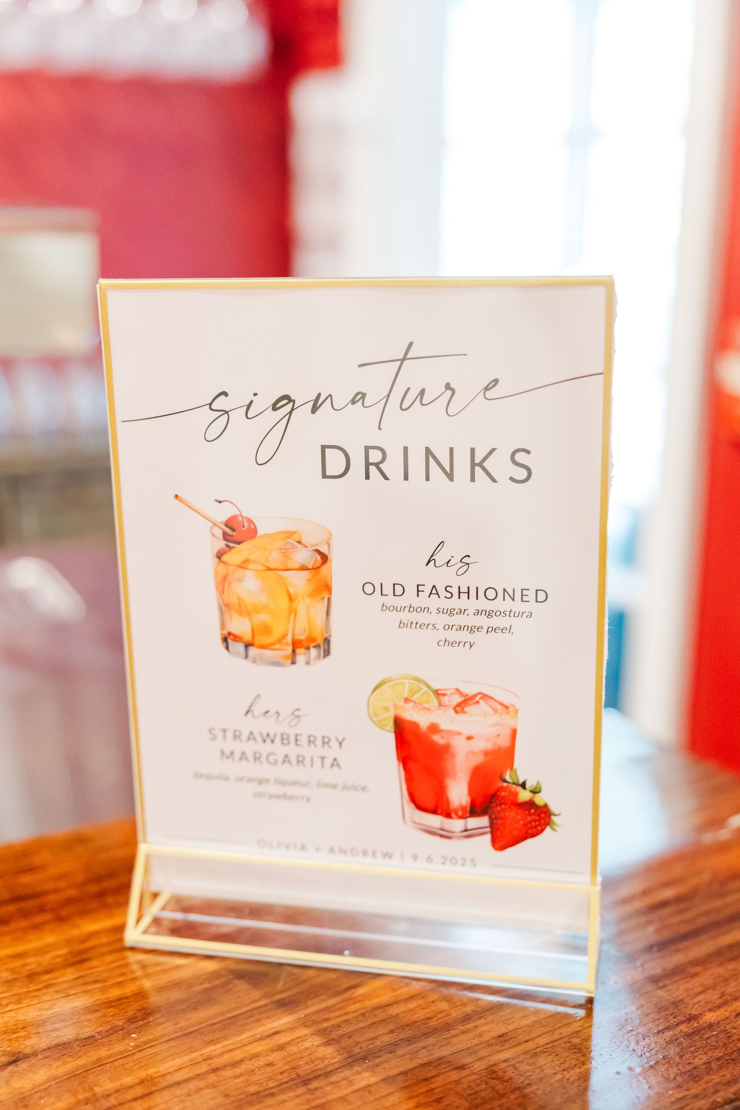 Elegant signature cocktail menu cards featuring illustrated drinks on wooden table.