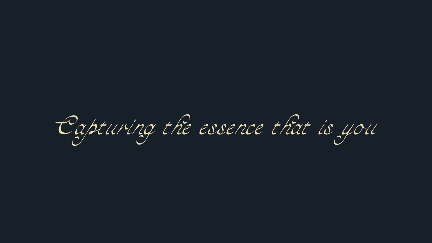 Elegant cursive text reading 'Capturing the essence that is you' on a dark background.