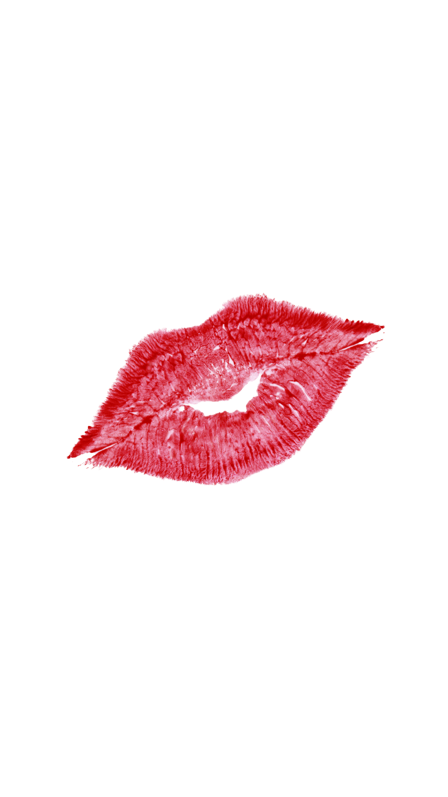 Red lipstick kiss mark imprint isolated on black background.