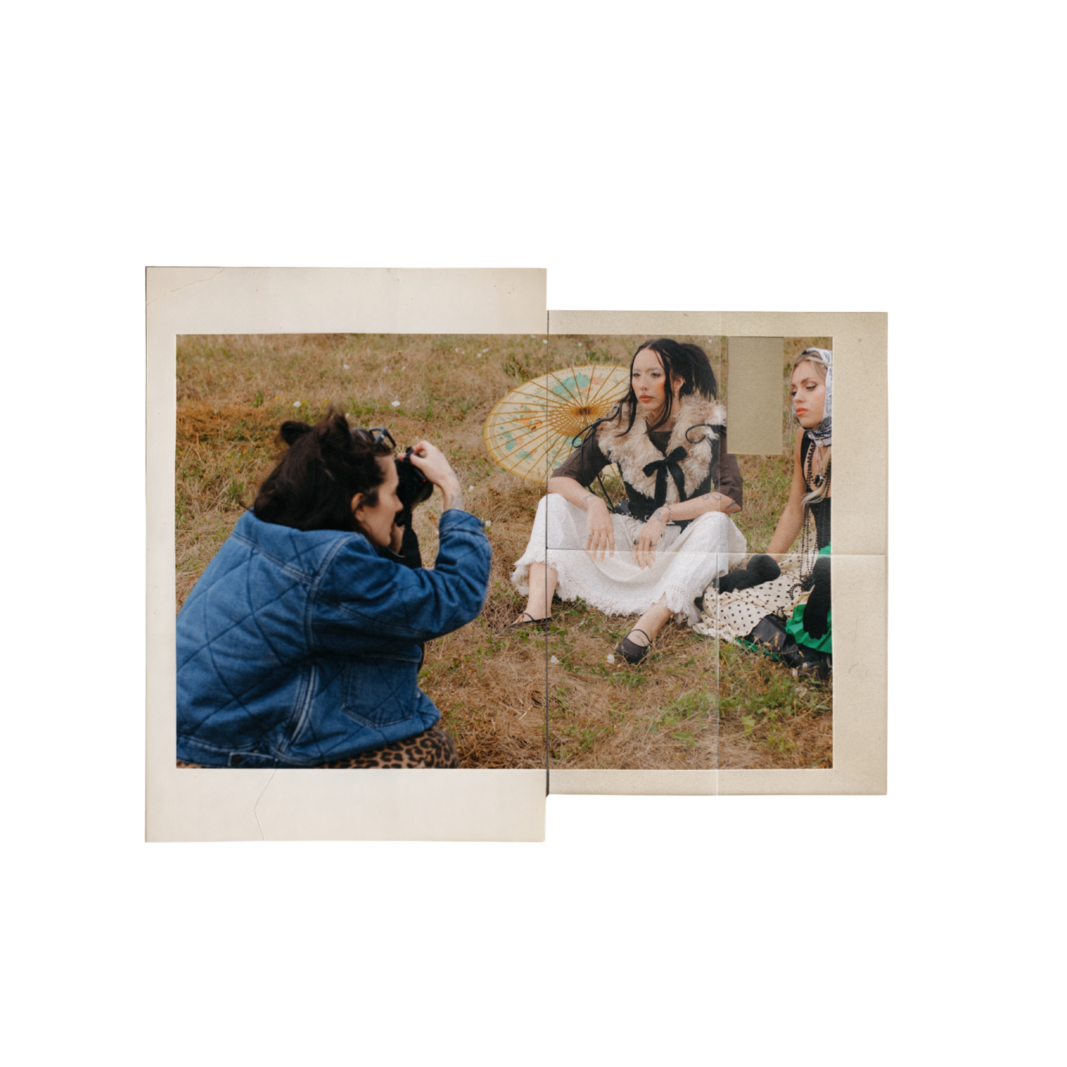 Behind-the-scenes photo of a photographer capturing subjects sitting in a field.
