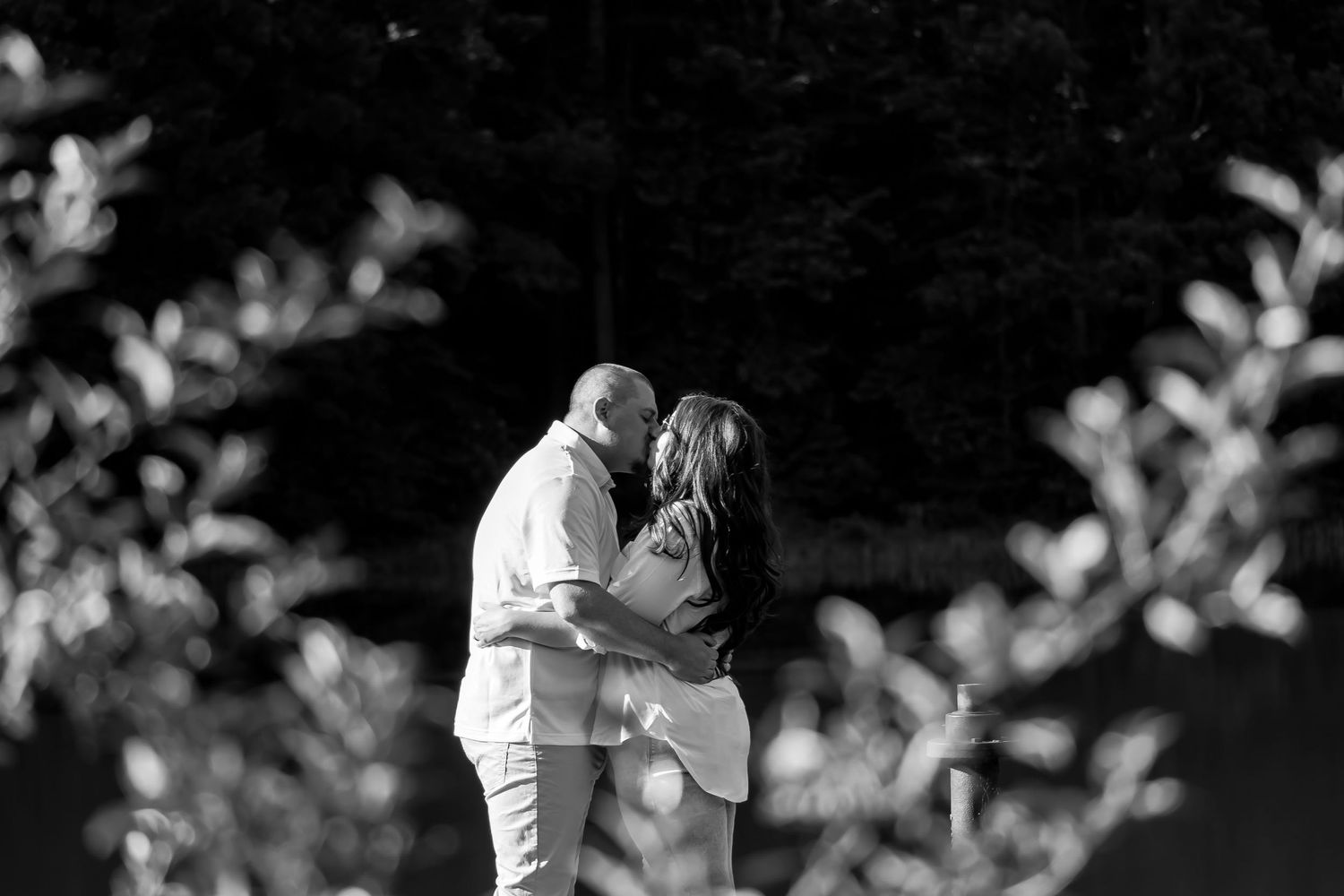Romantic black and white photo series showing tender moments between a couple.