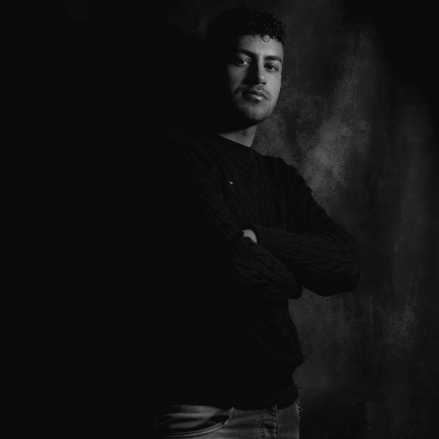 Dramatic black and white portrait photography series with moody lighting.