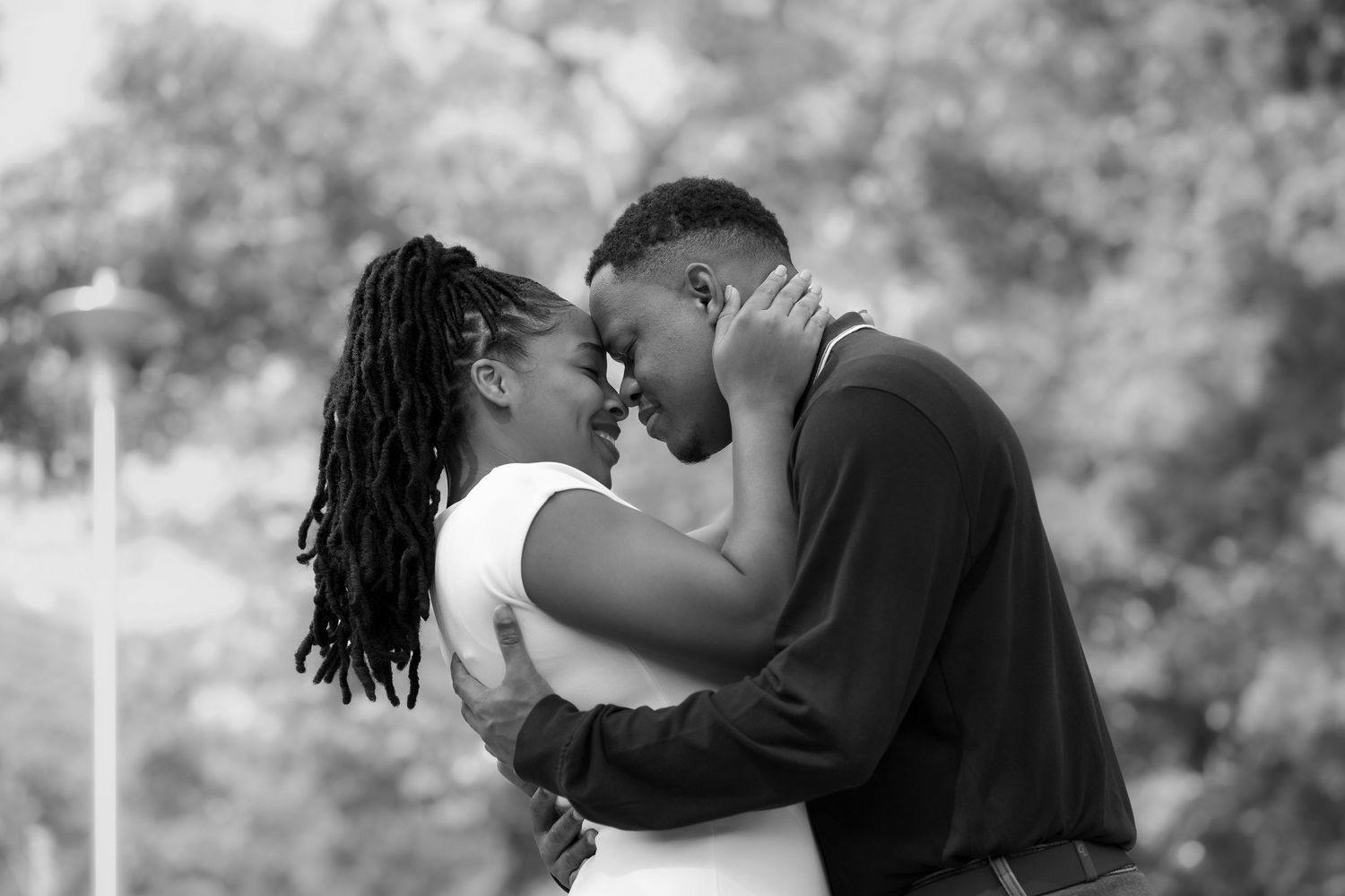 Black and white romantic outdoor photo series capturing intimate moments between a couple.