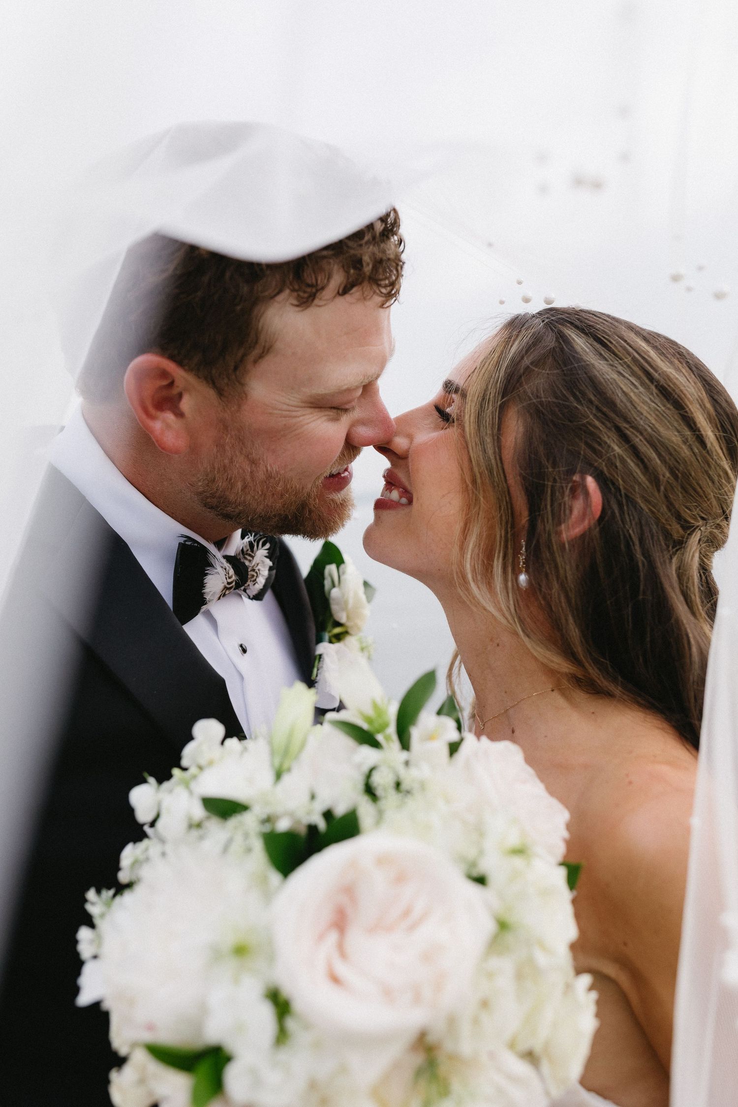 Bride and groom under veil couple portrait at Lake Murray South Carolina wedding photography