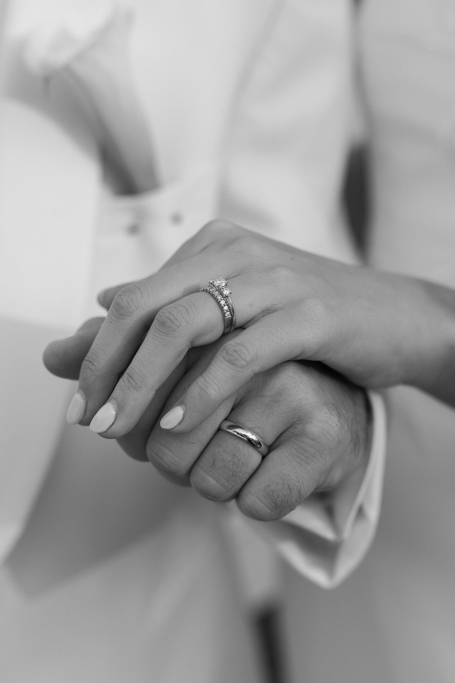 Bride and groom holding hands with wedding rings in a romantic detail shot on Johns Island South Carolina
