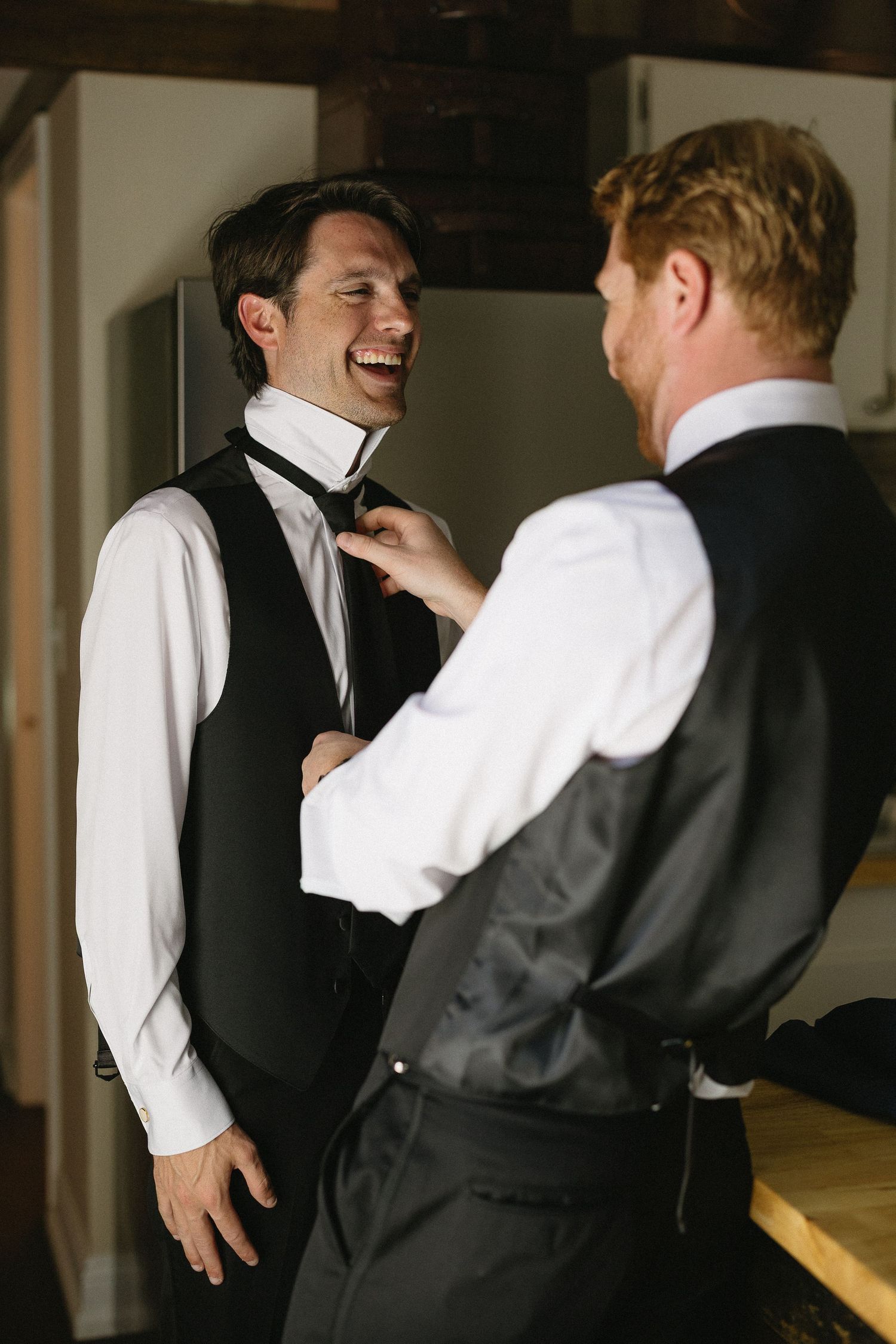 Candid groom getting ready photo in Pawleys Island South Carolina wedding photography