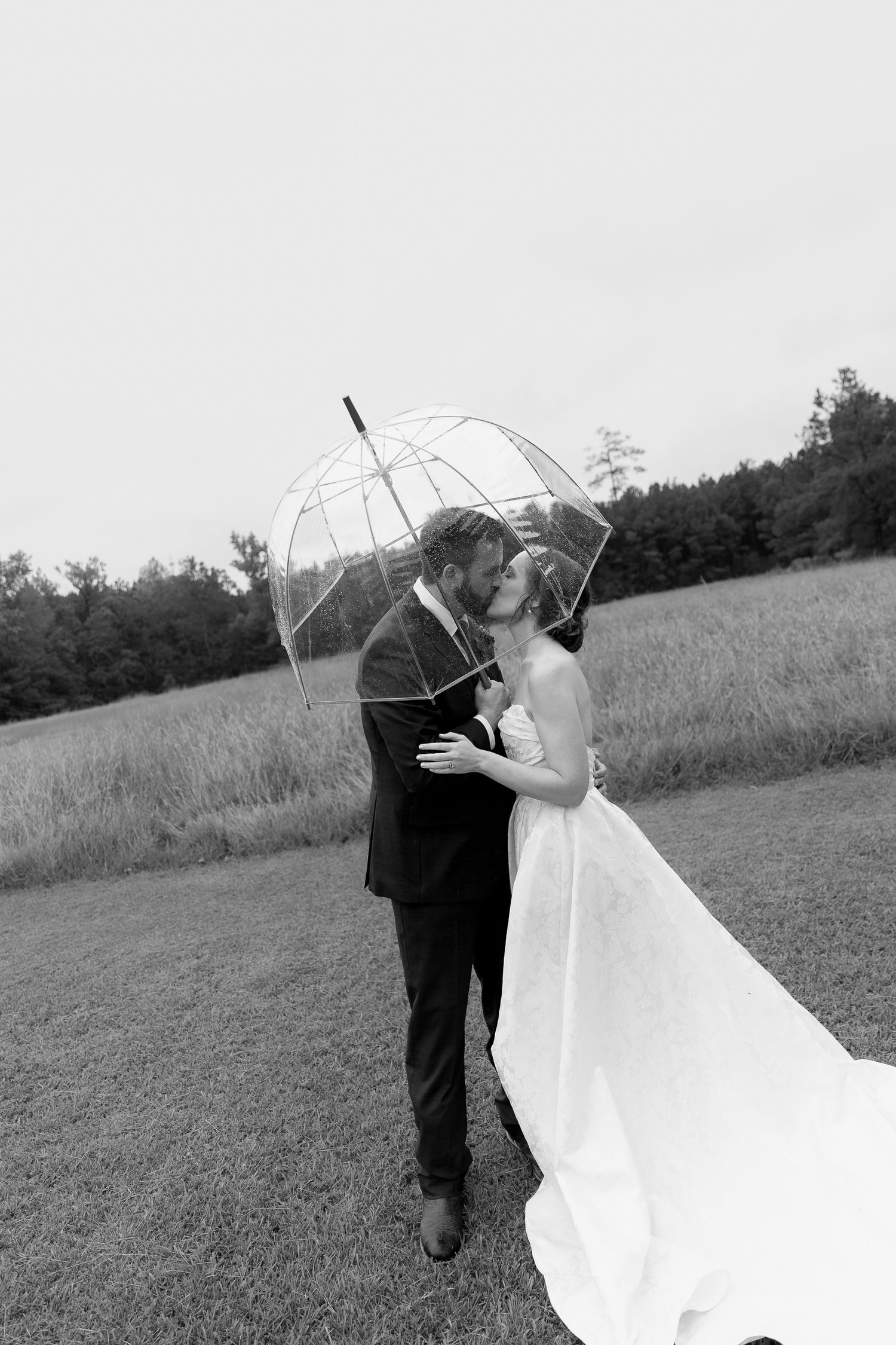 Romantic rainy wedding moment with bride and groom in Conway South Carolina