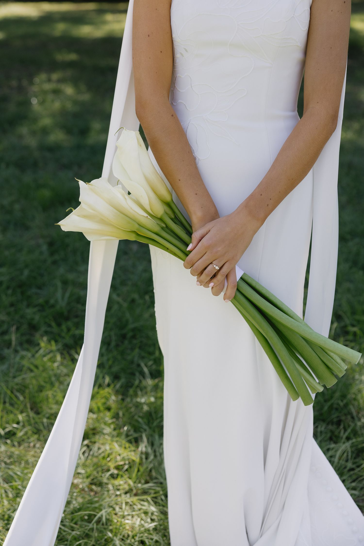 Bride holding bouquet of lilies on wedding day Johns Island South Carolina photography