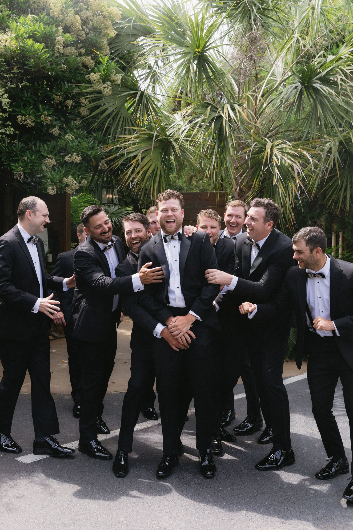 Groom and his groomsmen candid moment at The River Road and Jasmine Houses and Gardens in Columbia, SC