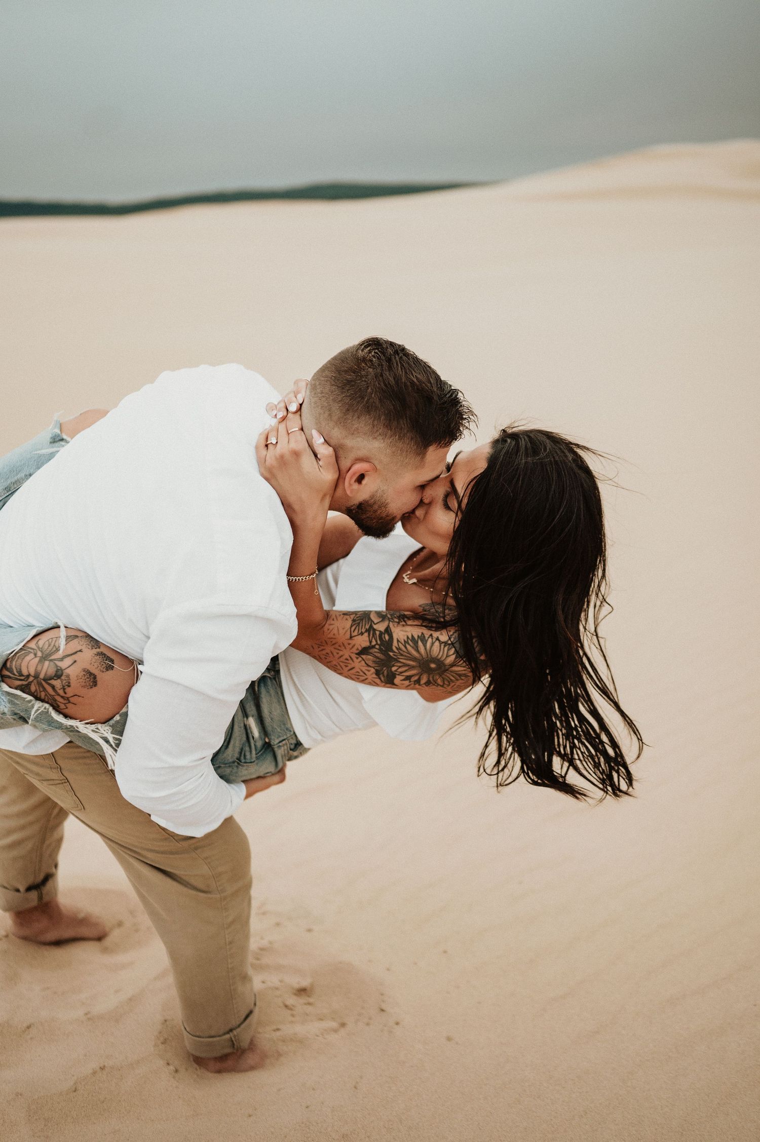 A tender moment shared between a couple during their desert photoshoot.