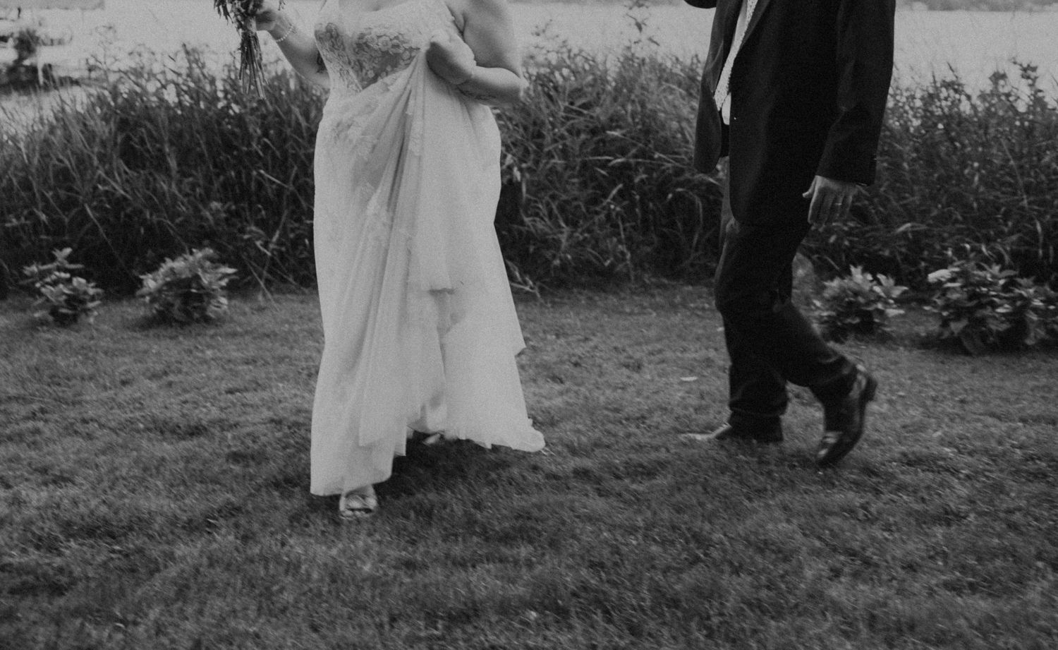 A couple embraces in a series of black and white wedding photos taken outdoors.