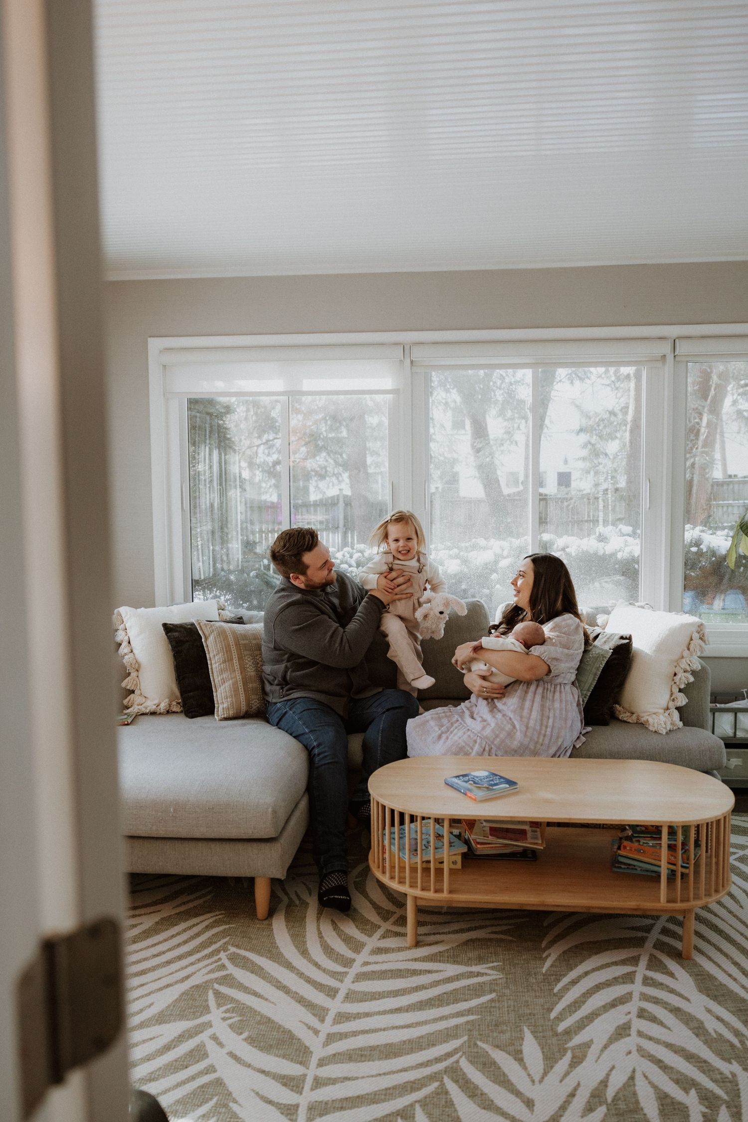 A cozy living room scene with a modern round coffee table and plush sectional sofa.