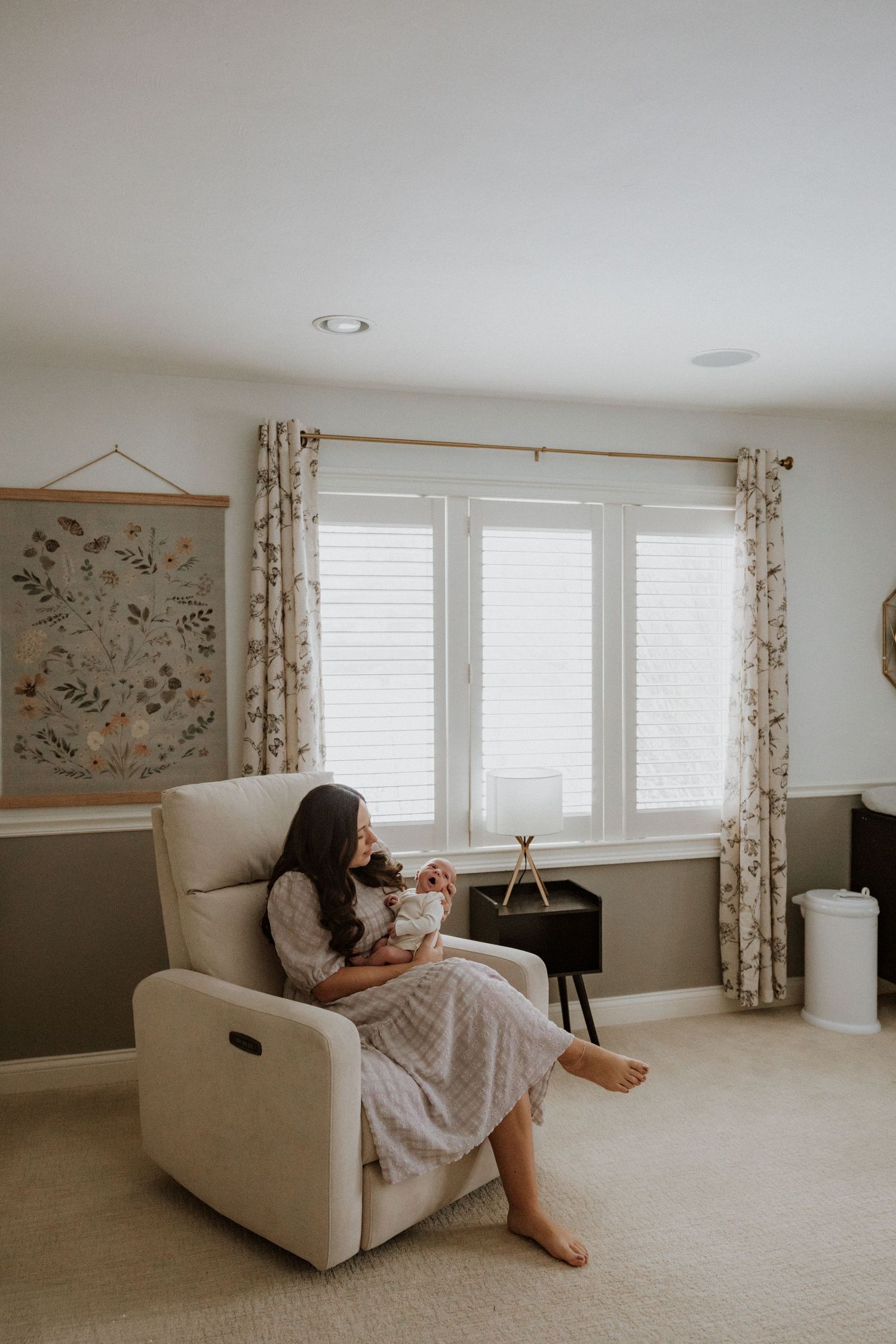 A series of four photos showing a minimalist living room with white walls, floral curtains, and a beige recliner chair.