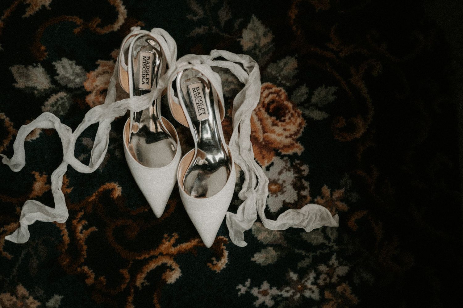 Artistic black and white composition of wedding dress details.