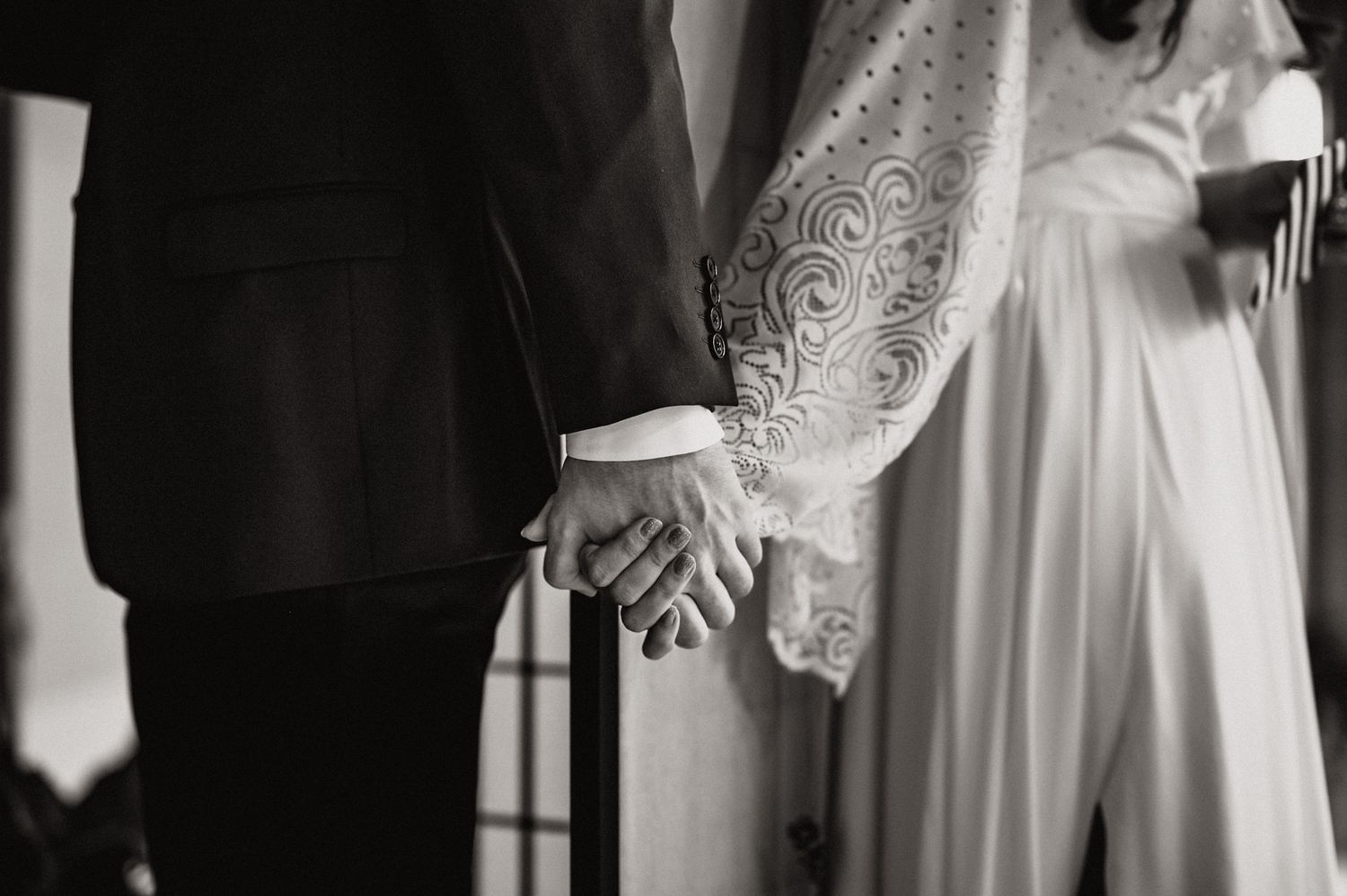 Romantic wedding party scene with guests celebrating in a dimly lit venue.