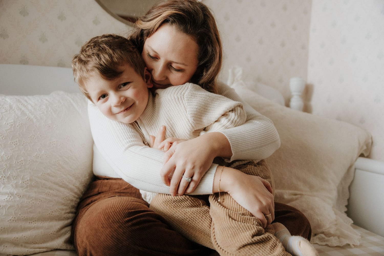 Soft and gentle lifestyle photography showing intimate family connections at home.