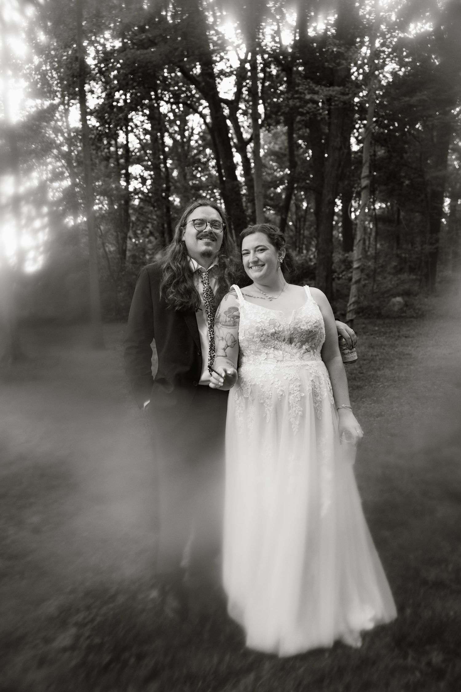 A series of ethereal black and white photos showing a figure in a white dress standing among misty trees in a forest setting.