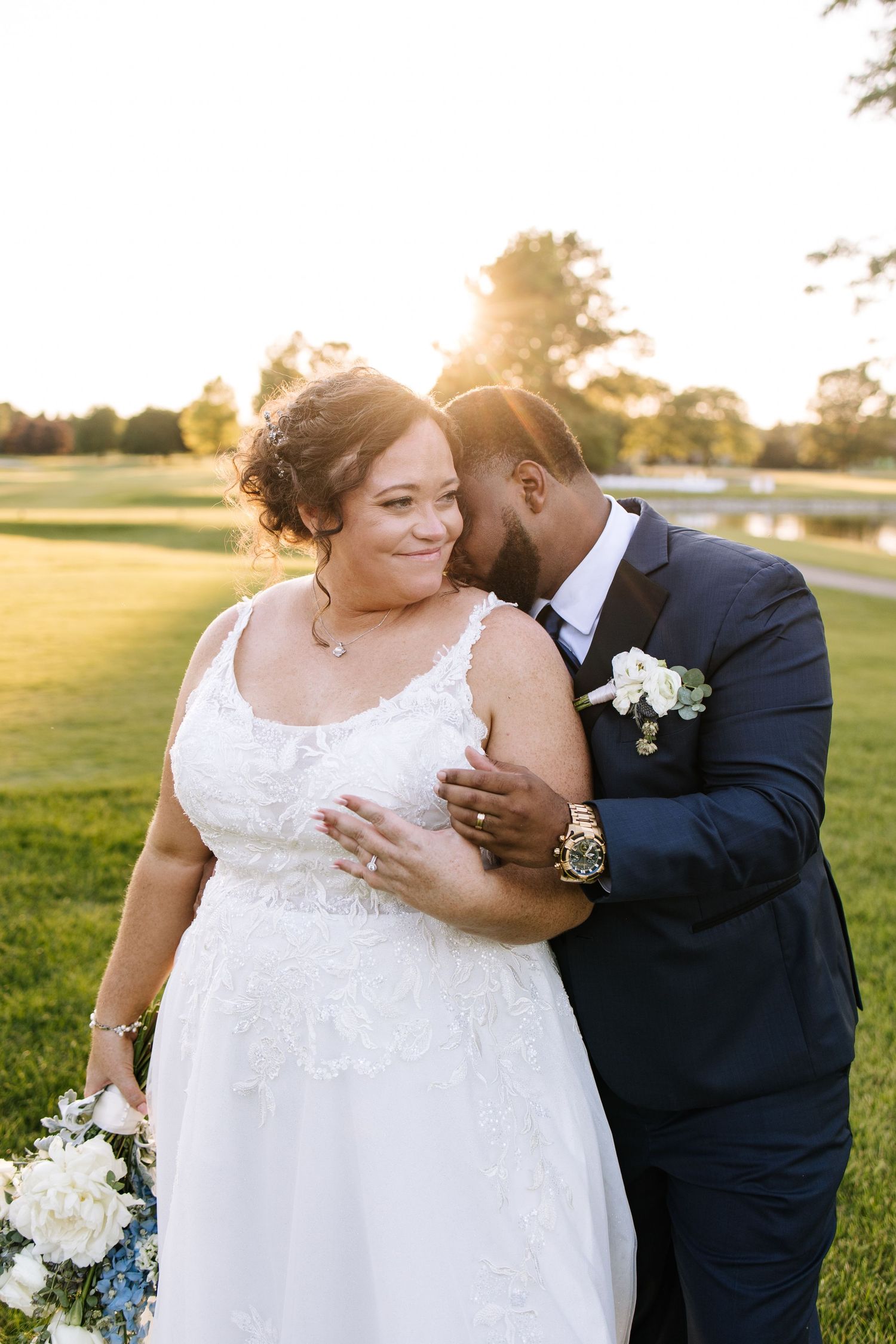 Romantic outdoor wedding photos at sunset showing tender moments between newlyweds in a grassy field.