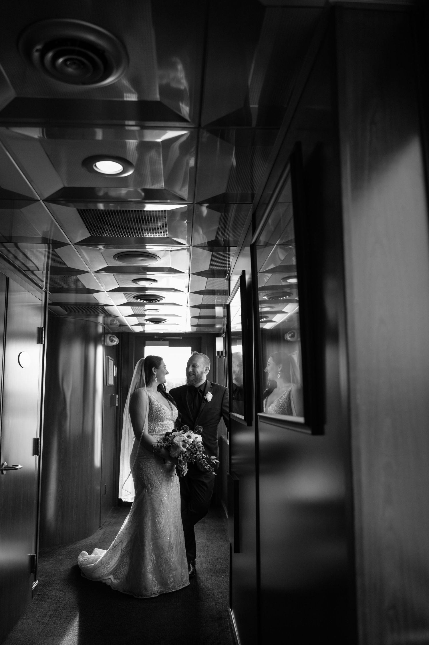 Dramatic black and white corridor photos with artistic lighting and reflections.