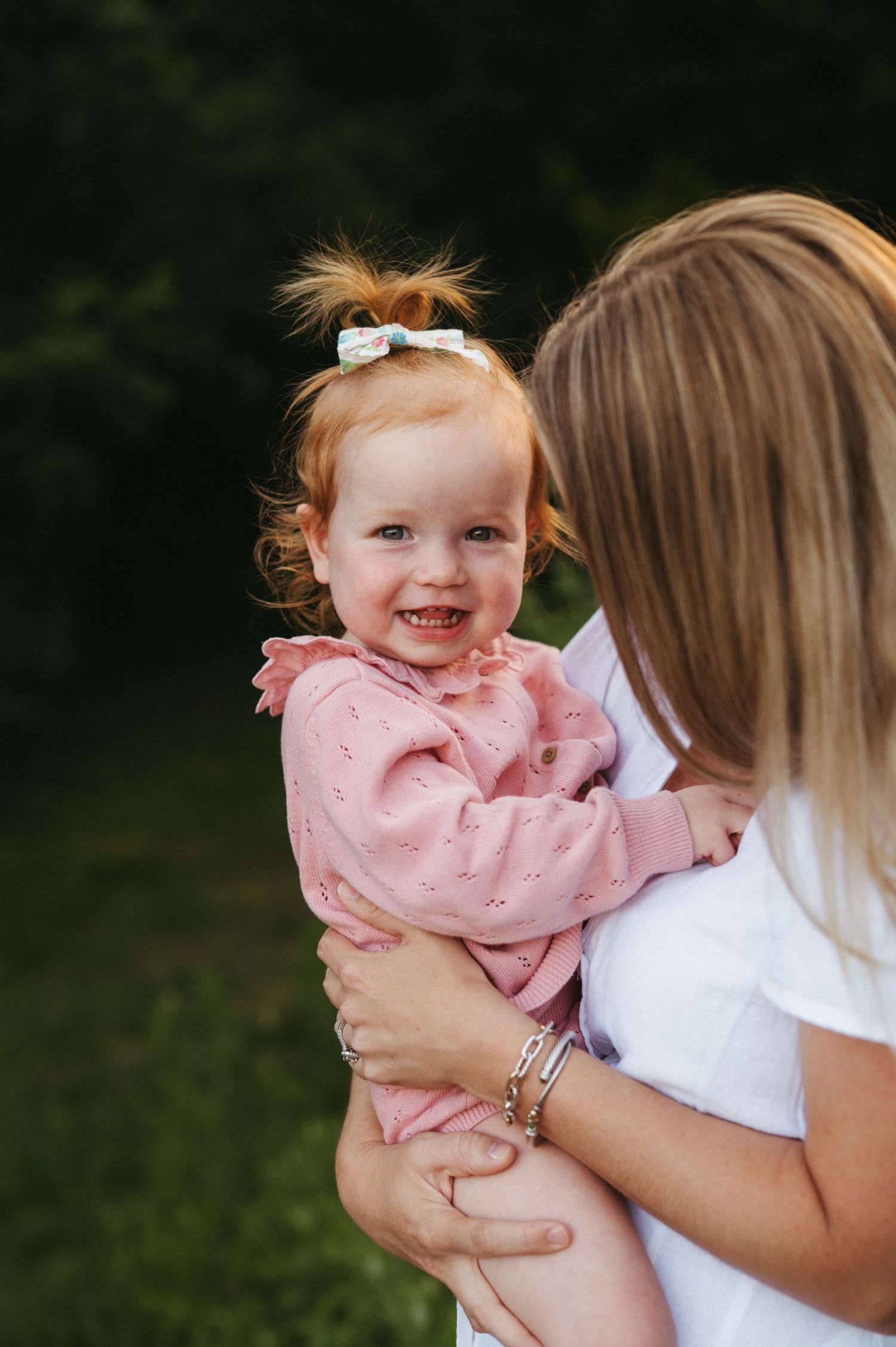 A heartwarming moment captured between two people in a natural outdoor setting.
