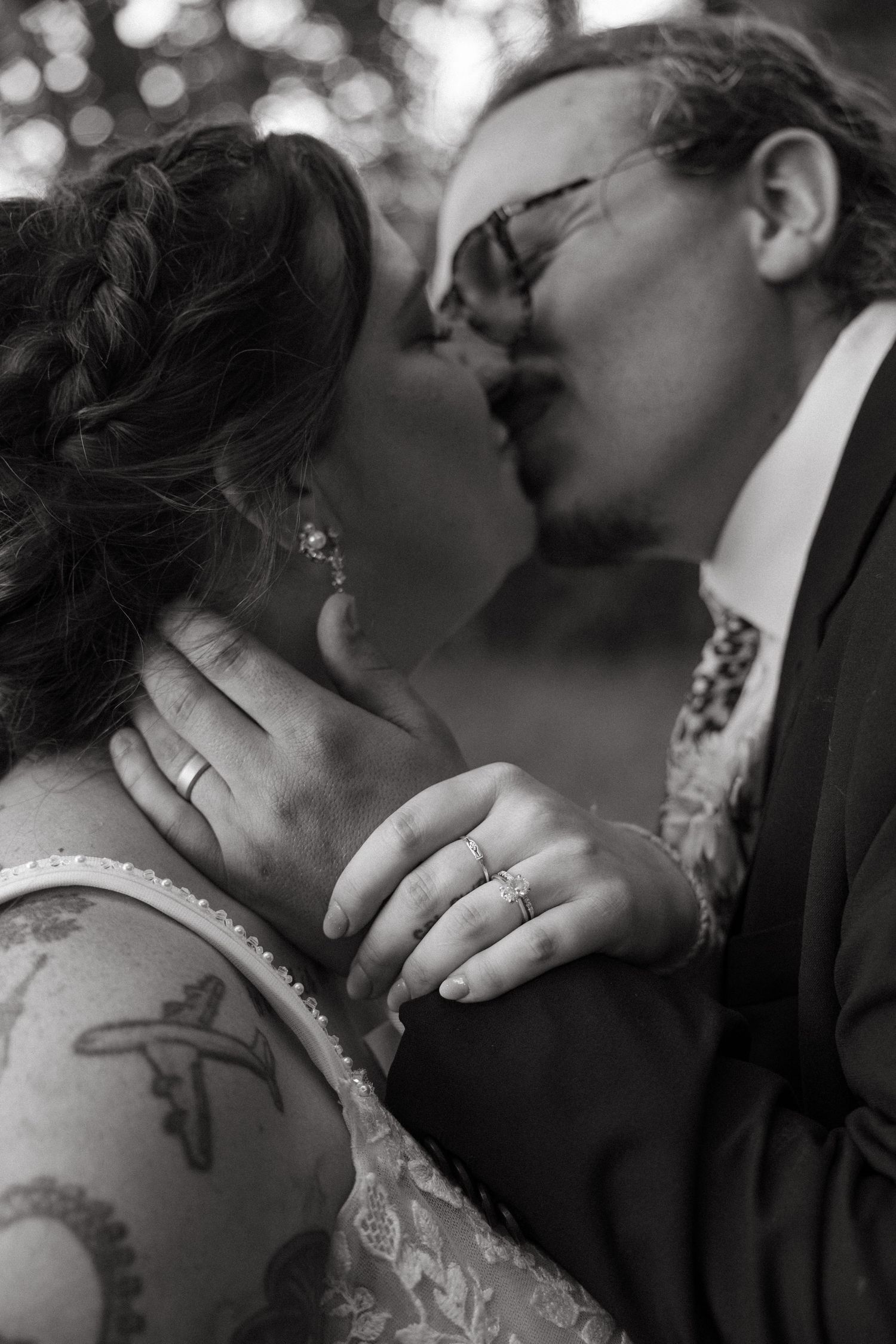 A romantic black and white series of close-up shots showing tender moments between newlyweds.