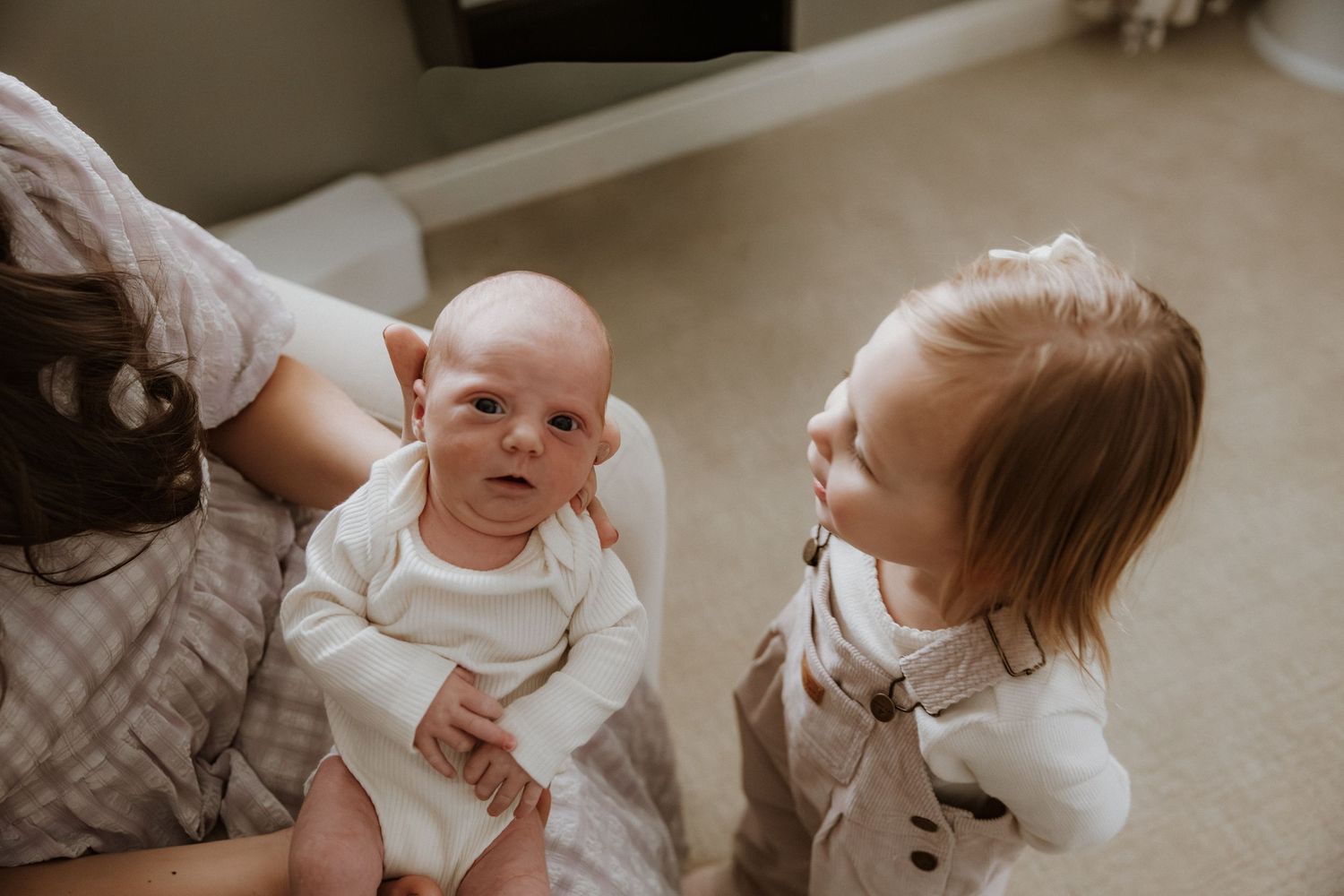 A series of candid lifestyle photos showing a baby and family members interacting together at home.