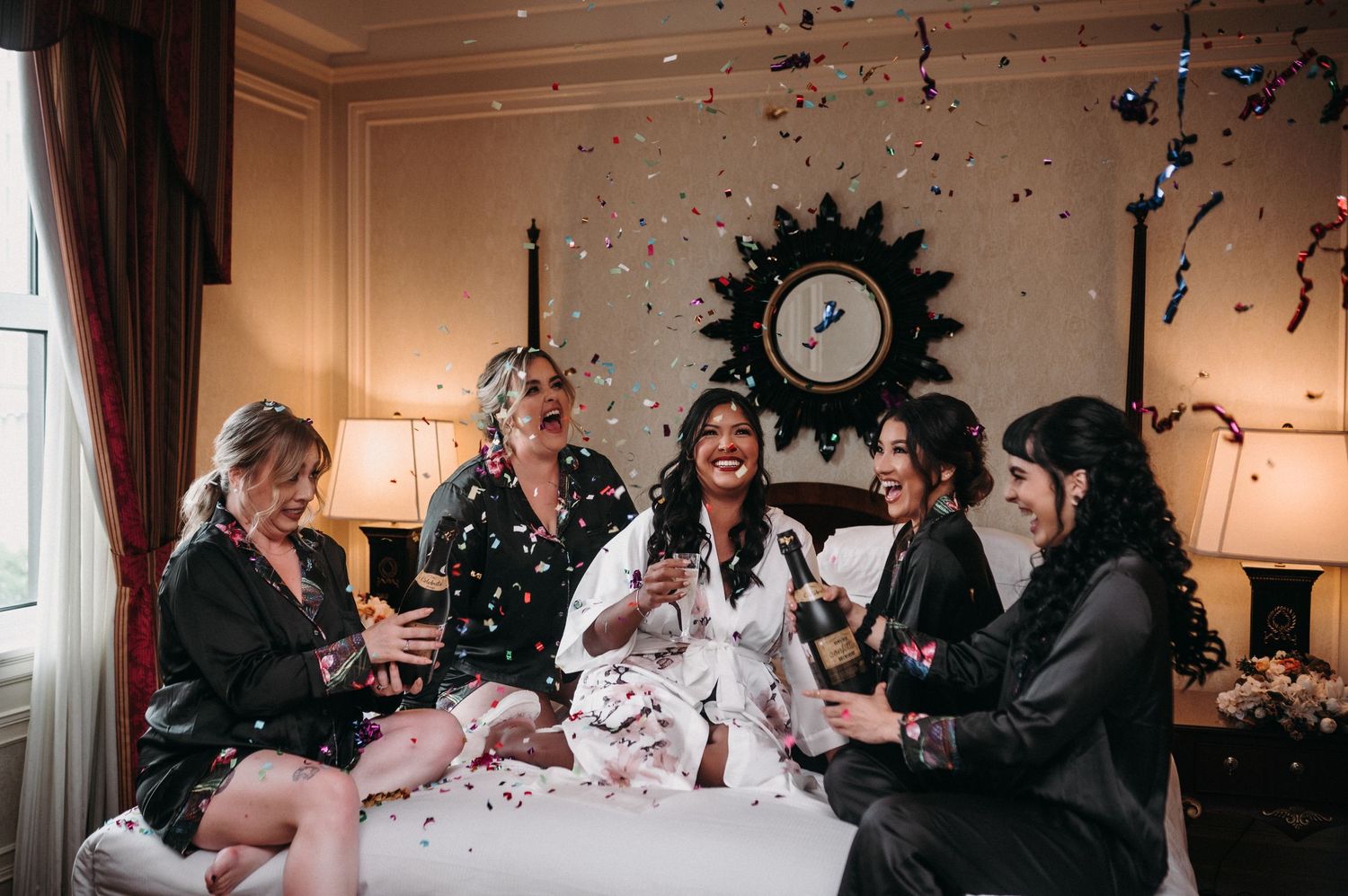Festive gathering with confetti and laughter in well-appointed room with decorative wall clock.