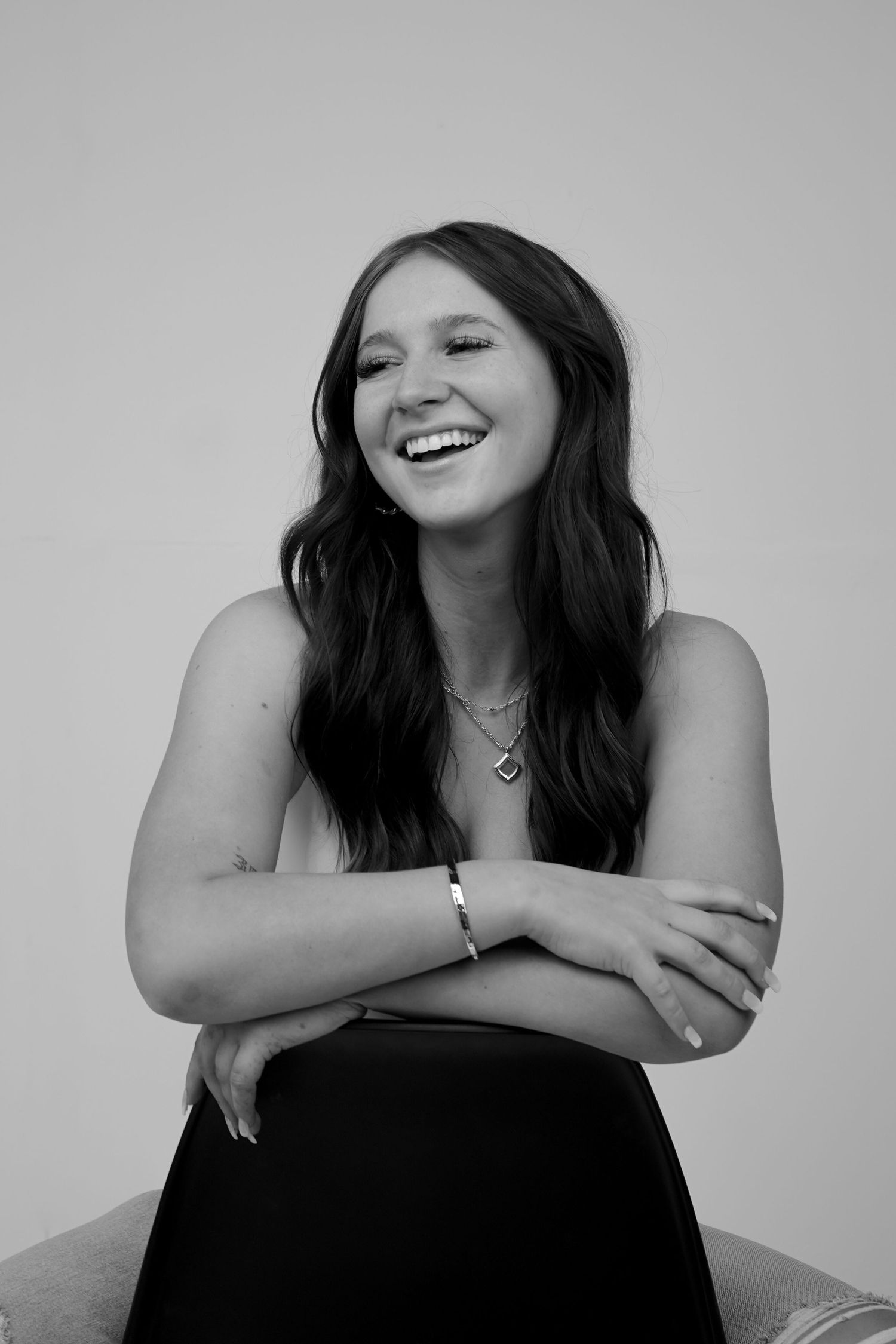 Black and white portrait series showing joyful expressions.