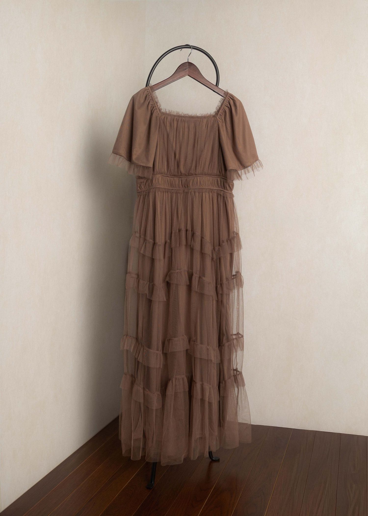 Elegant dusty rose tiered tulle maxi dress with off-shoulder flutter sleeves displayed on a hanger.