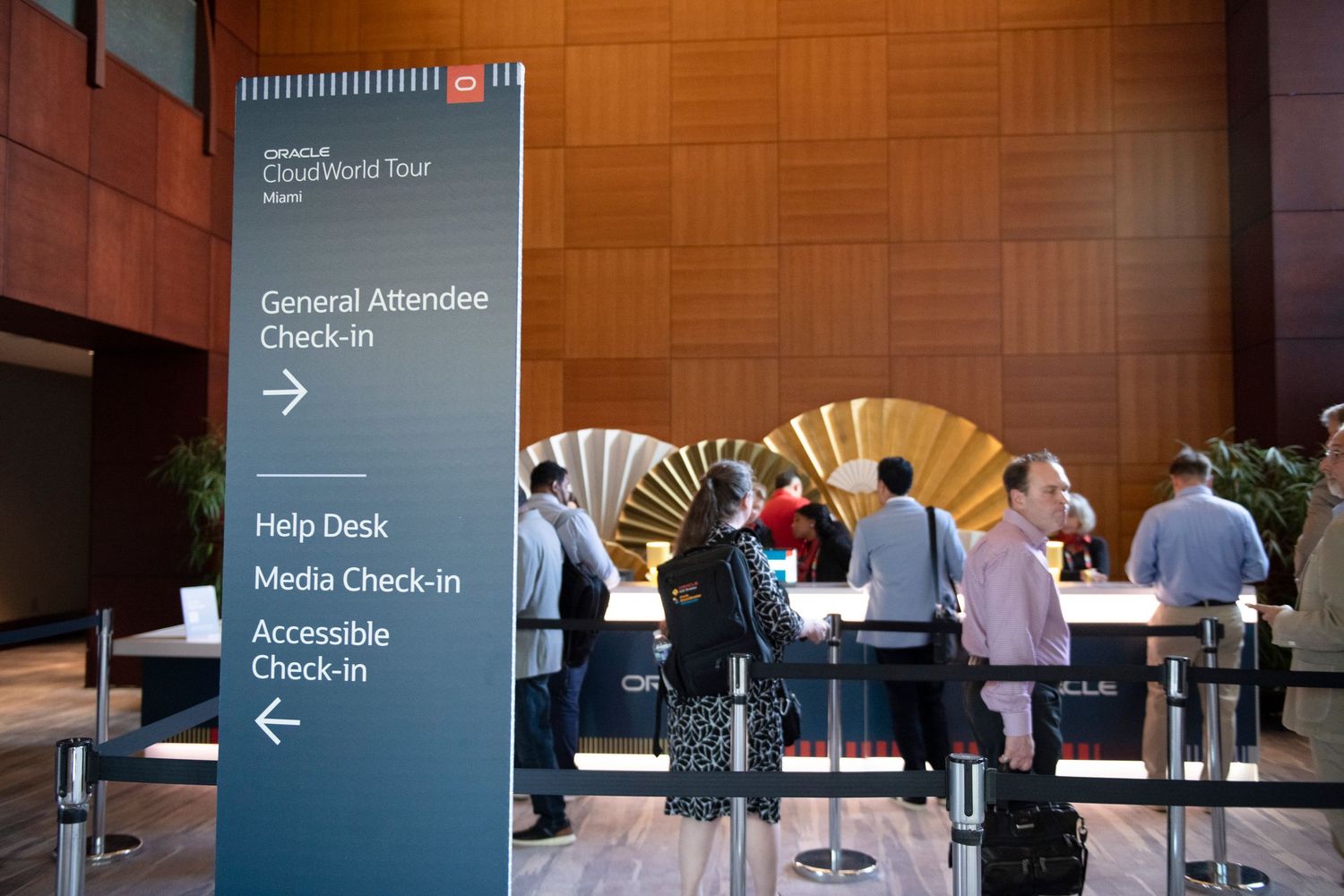 SAP CloudWorld Tour event check-in area with directional signage for general attendees, help desk, media, and accessible check-in.