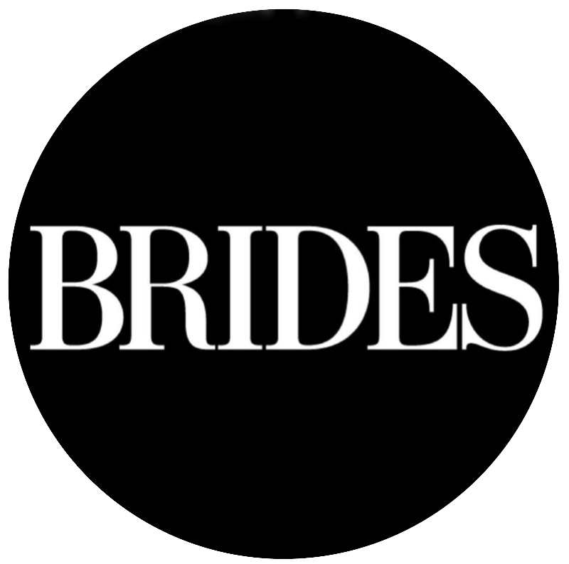Black circular logo featuring white text spelling 'BRIDES' in a bold, elegant serif typeface against a dark background.