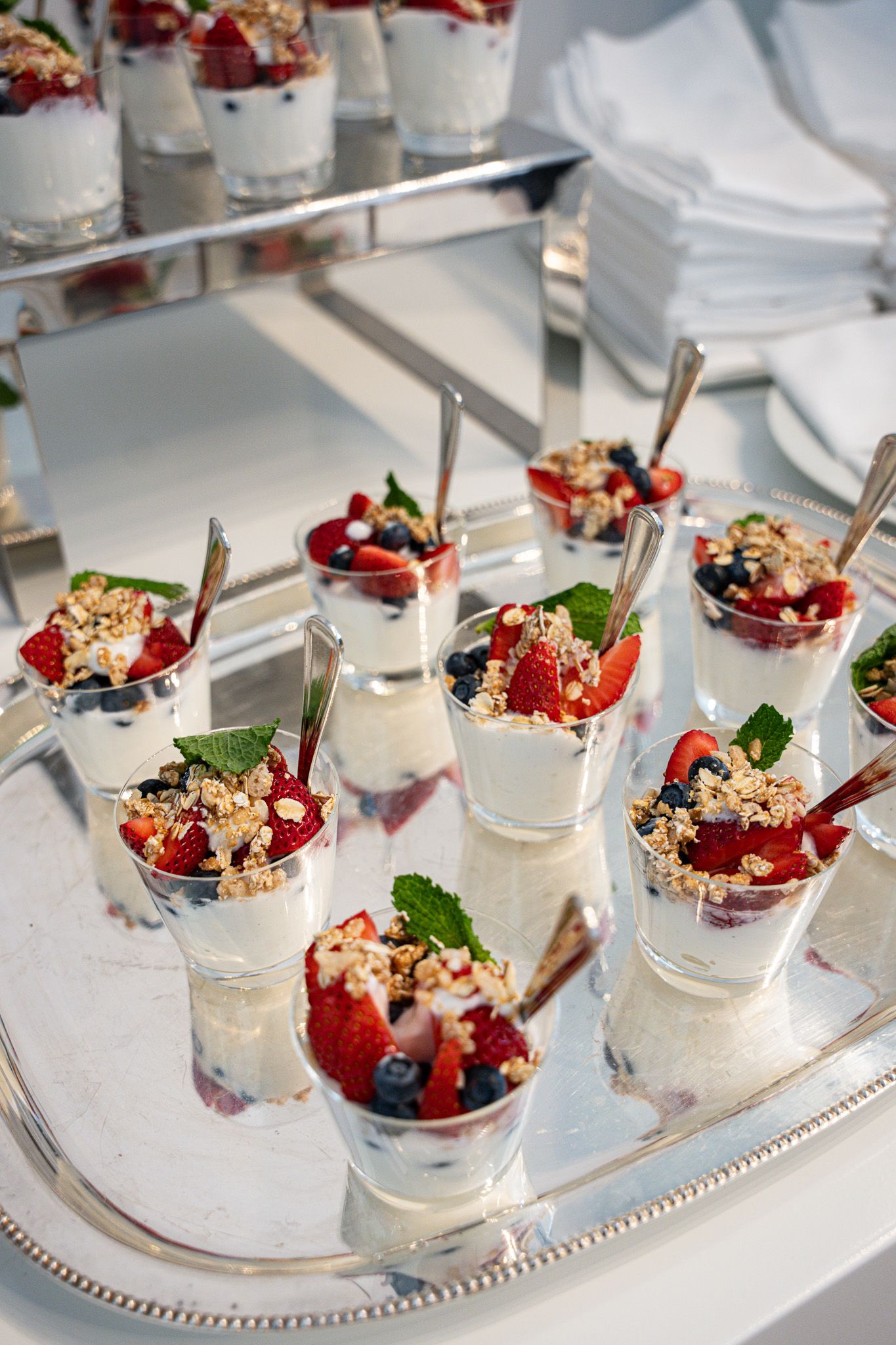 Corporate event photography of yogurt parfaits on a silver platter inside a luxury suite at the U.S. Open Golf Championship in the Hamptons.