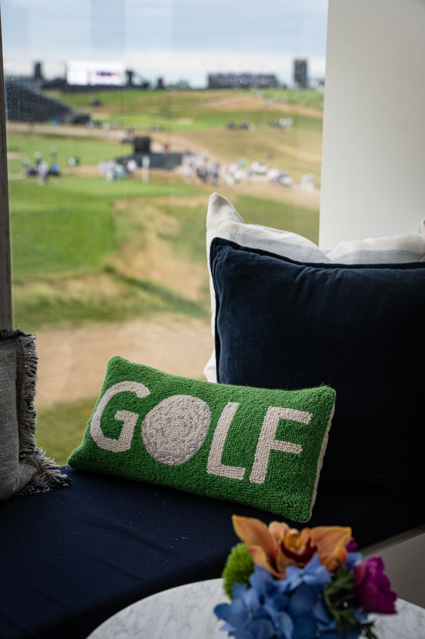 Event photography of a couch with a pillow with the word 