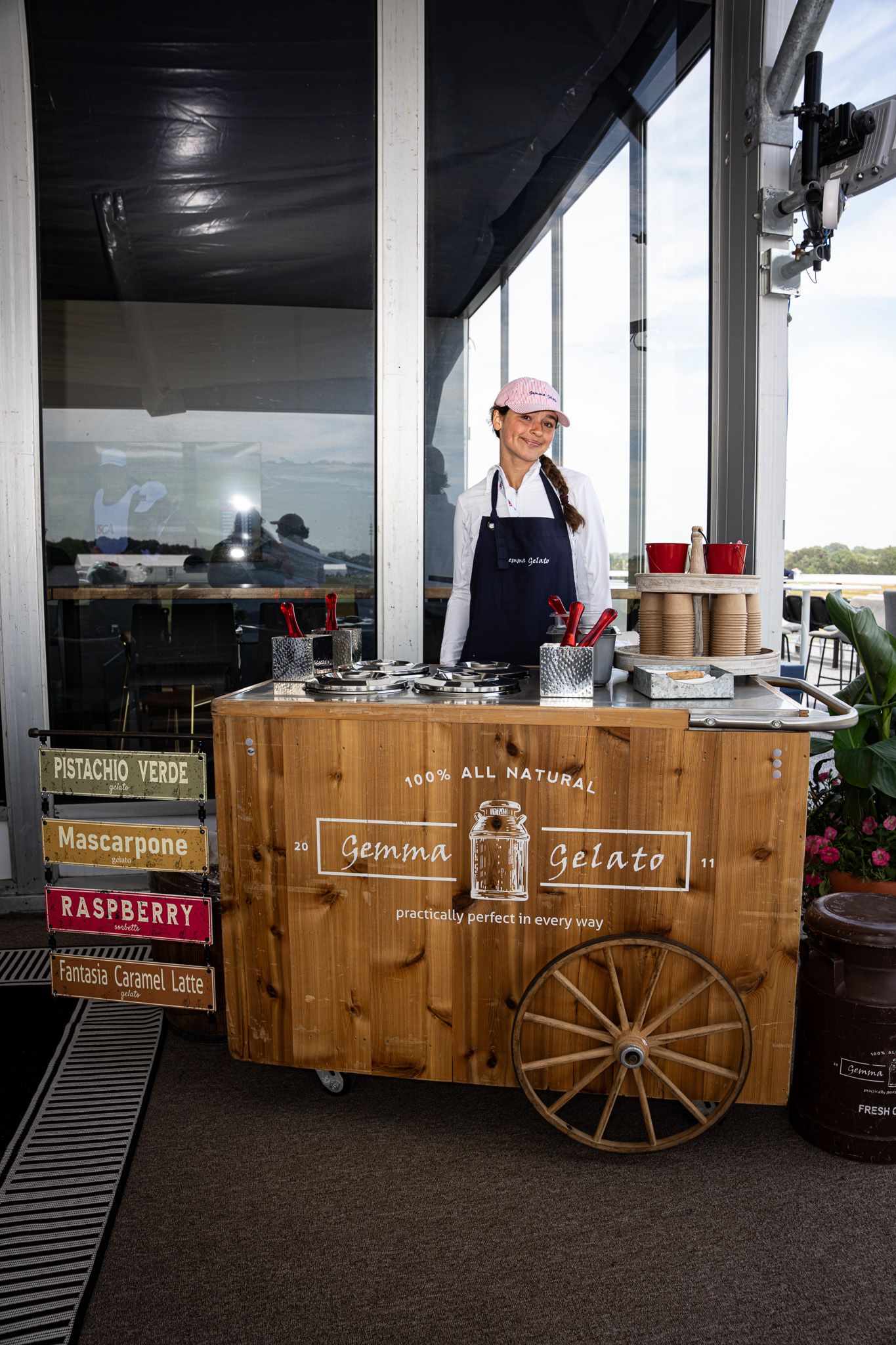 Brand photography of a girl serving gourmet gelato inside a luxury suite at the U.S. Open Golf Tournament in the Hamptons, New York.
