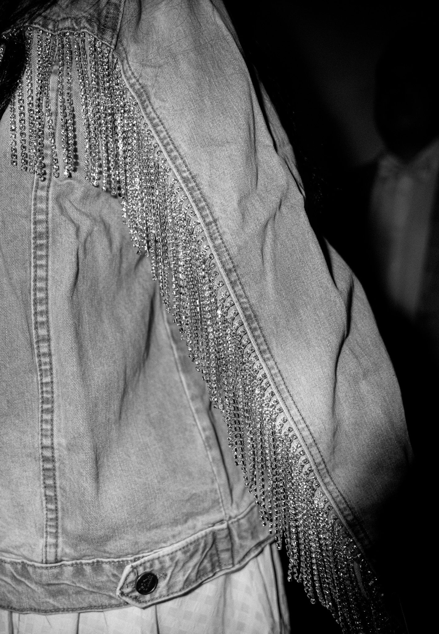 Denim jacket with diamond fringe sleeves during a Kentucky Derby party at The Poynt in Newburyport, Massachusetts