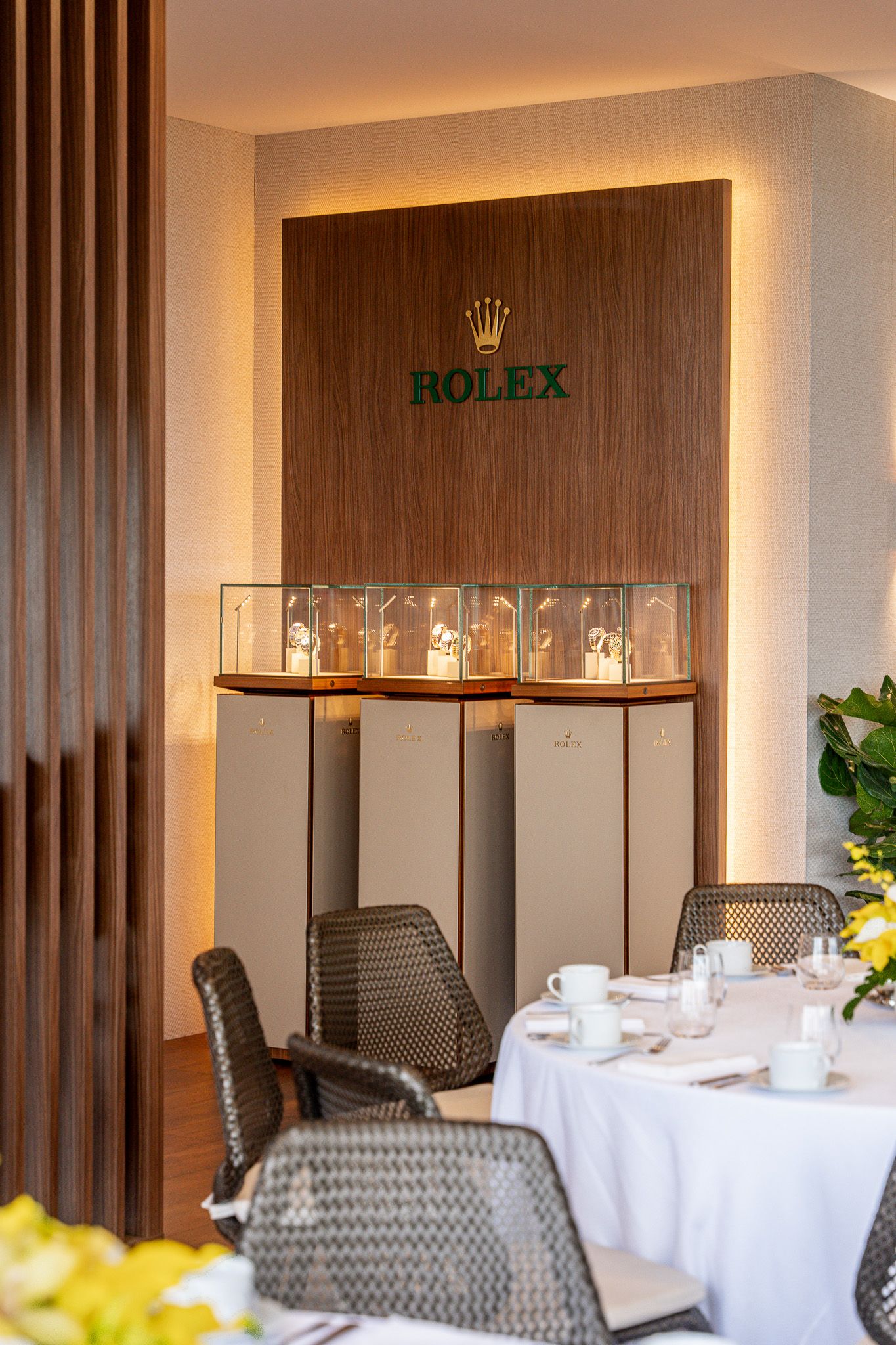 Corporate event photography of a company suite at the U.S. Open Golf Championship in the Hamptons, NY featuring a Rolex watch display stand