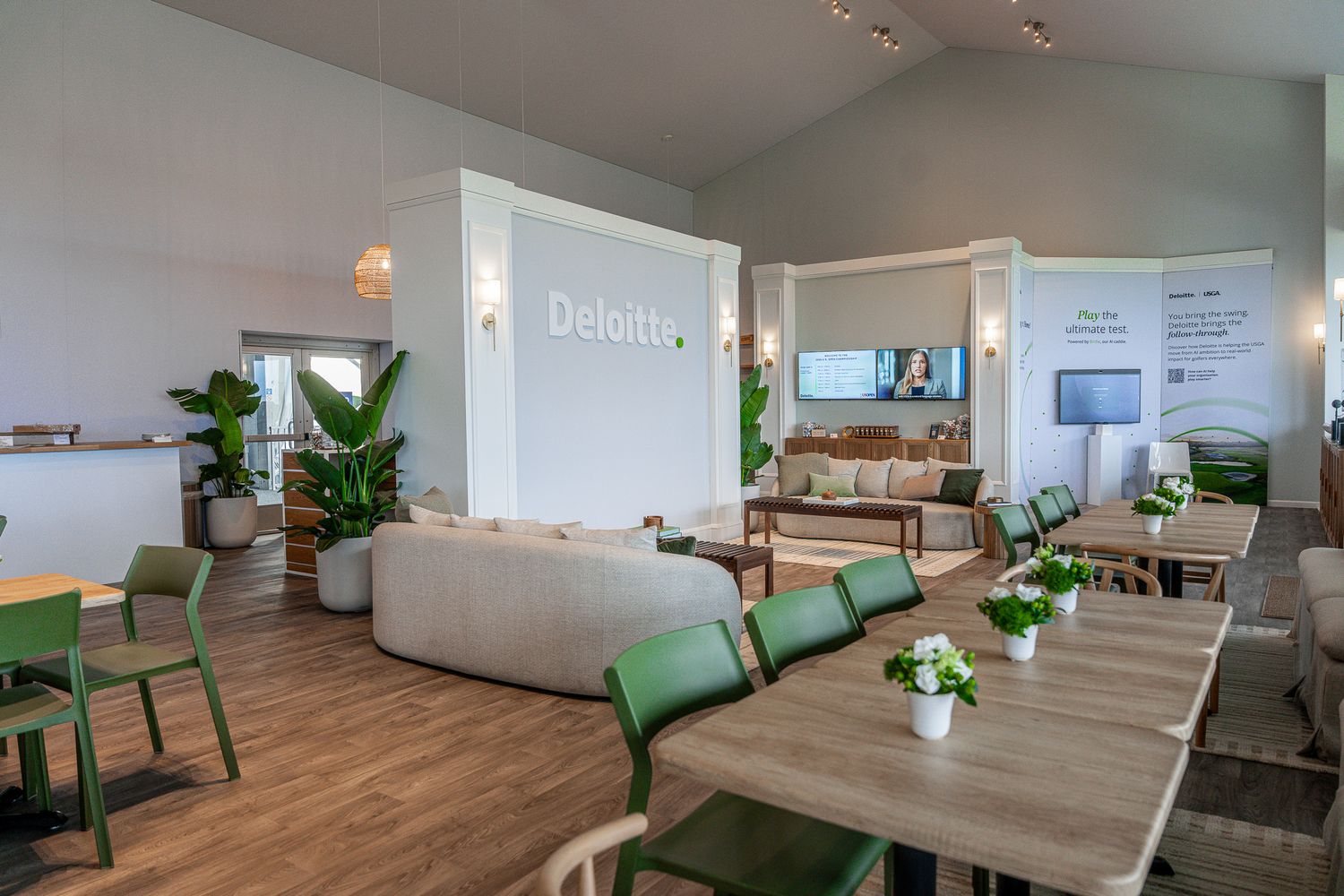 Corporate event photography of a company suite at the U.S. Open Golf Championship in the Hamptons, NY featuring a modern dining table