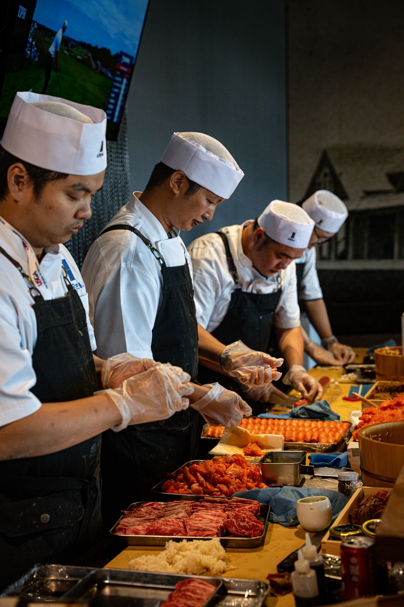 Event photography of Sushi chefs preparing sashimi inside the 1895 Club at the U.S. Open Golf Championship in the Hamptons, New York.