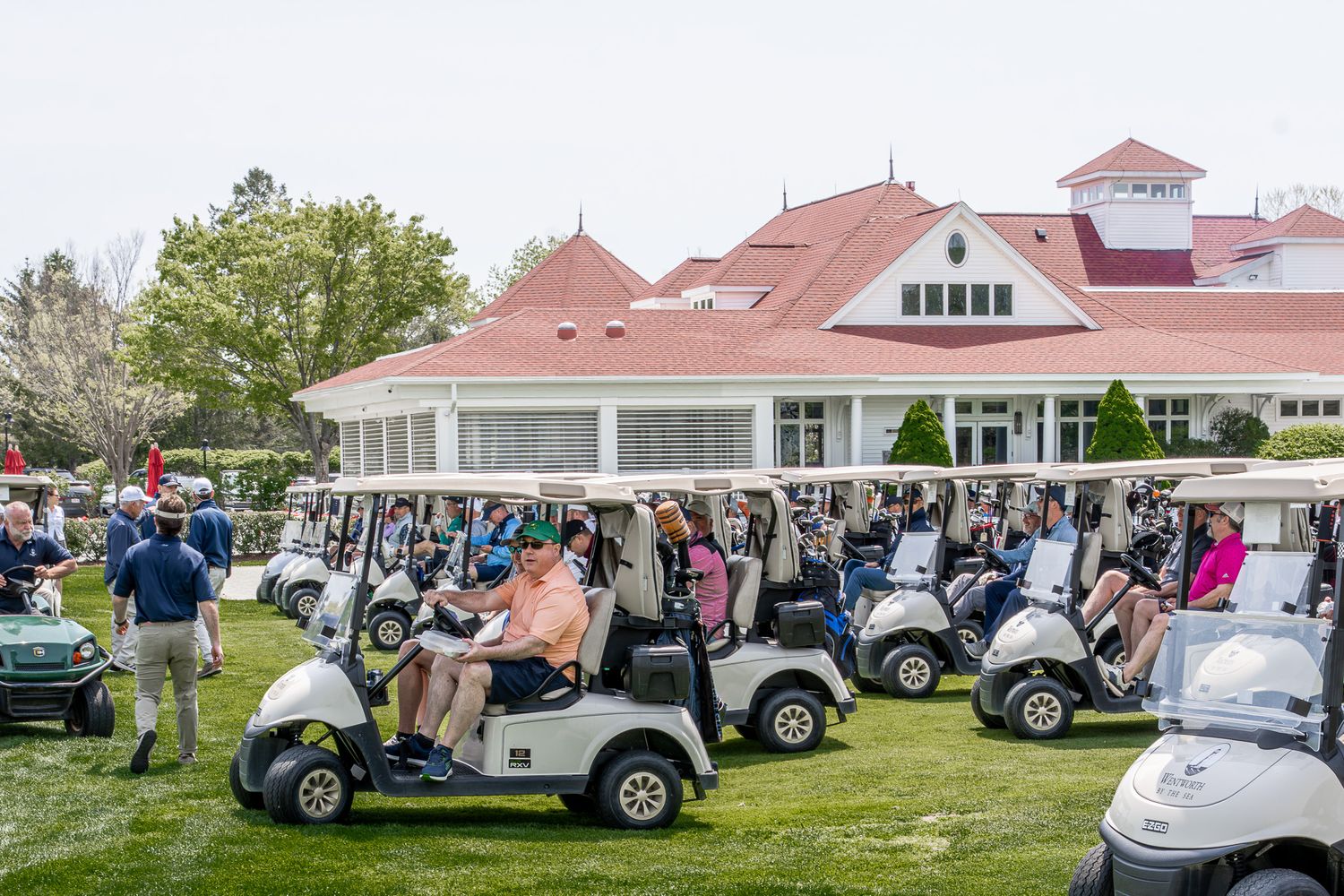Event photography of guests on golf carts during a charity tournament at Wentworth by the Sea Country Club in Portsmouth, New Hampshire.