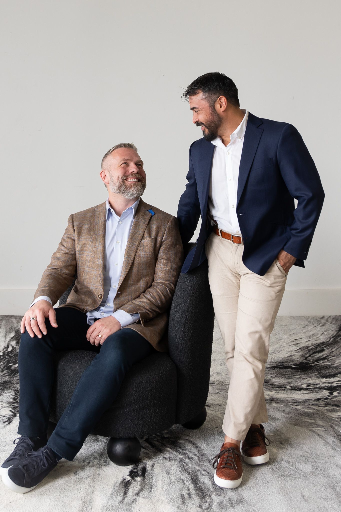 Two grooms look at each other before their wedding in Washington, D.C.