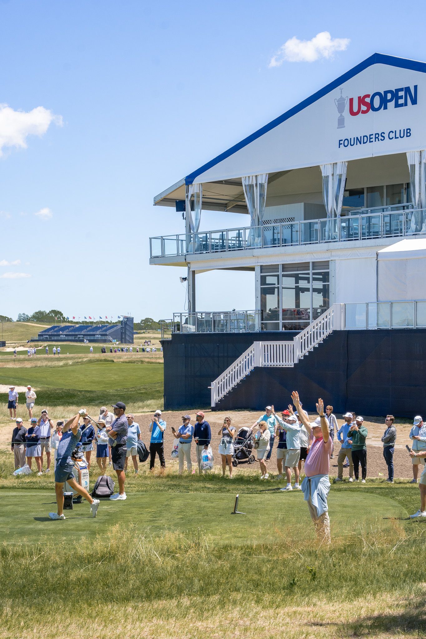 Event photography of golfers and spectators outside the Founder's Club at the U.S. Open Golf Championship in the Hamptons, New York.