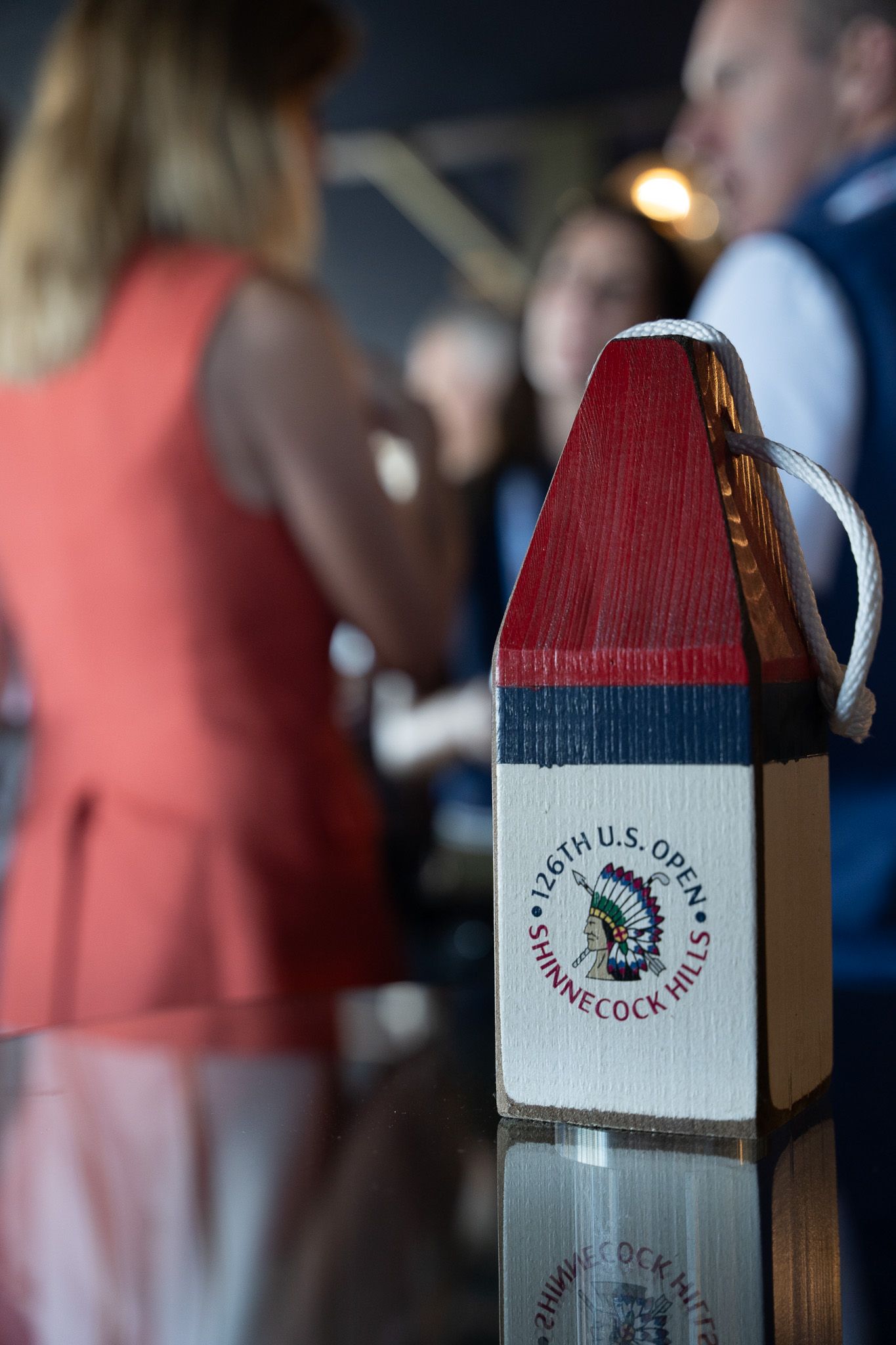 Corporate event photography of a U.S. Open Golf Tournament lighthouse souvenir at Shinnecock Hills in the Hamptons, New York.