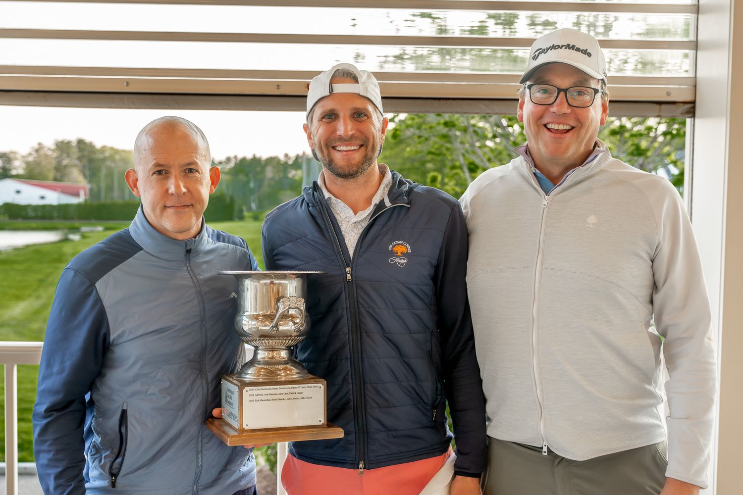 Event photography of man holding a trophy for a golf tournament at Wentworth by the Sea country club in Portsmouth, New Hampshire.