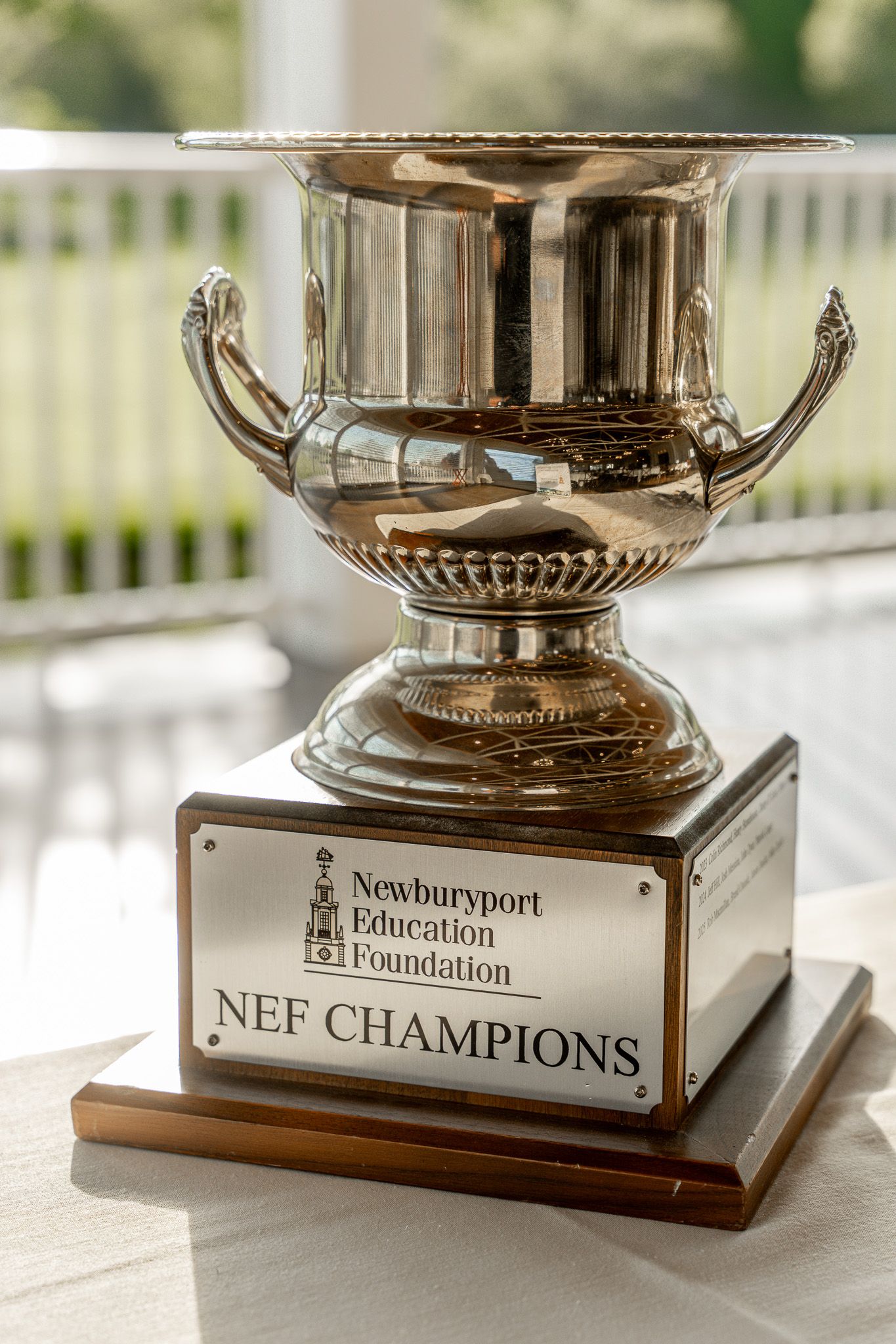 Event photography of the Newburyport Education Foundation golf tournament champion's cup at Wentworth by the Sea Country club.