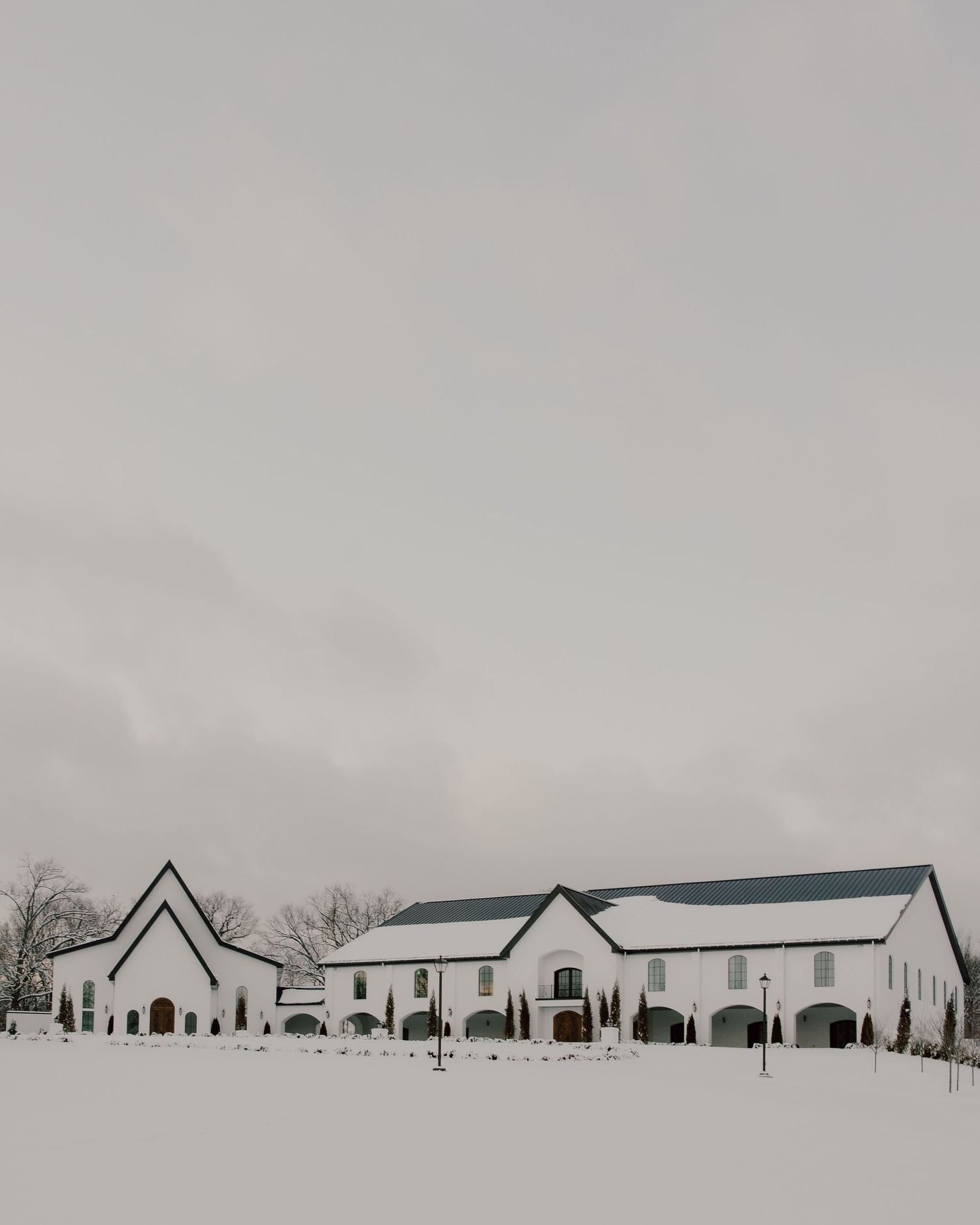 Luxury elegant wedding venue, The Grand at Willow Springs in Northwest Arkansas on a snowy winter day. White, timeless, classic venue.