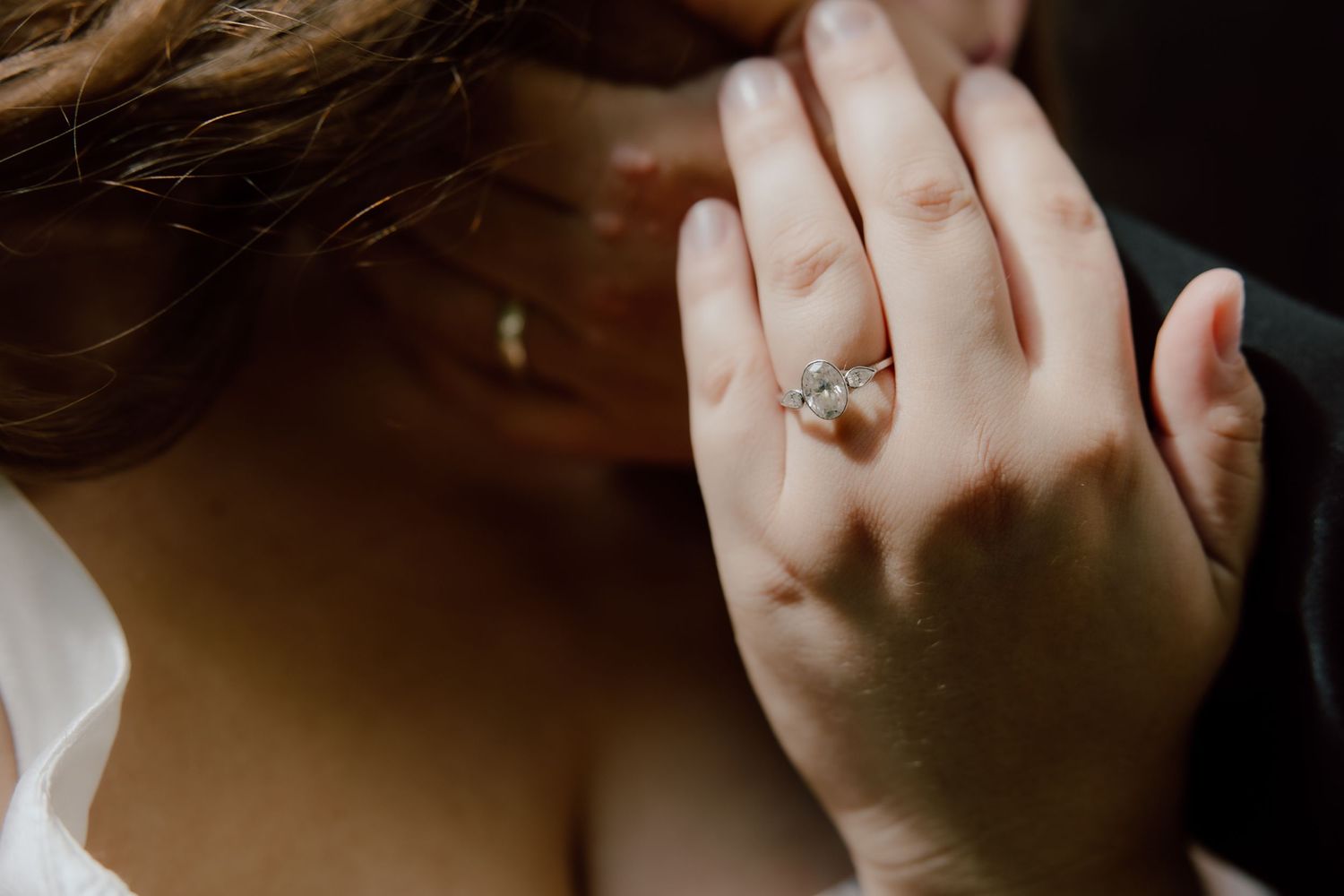 Direct sunlight editorial detail photo featuring the couples showing off their wedding rings.