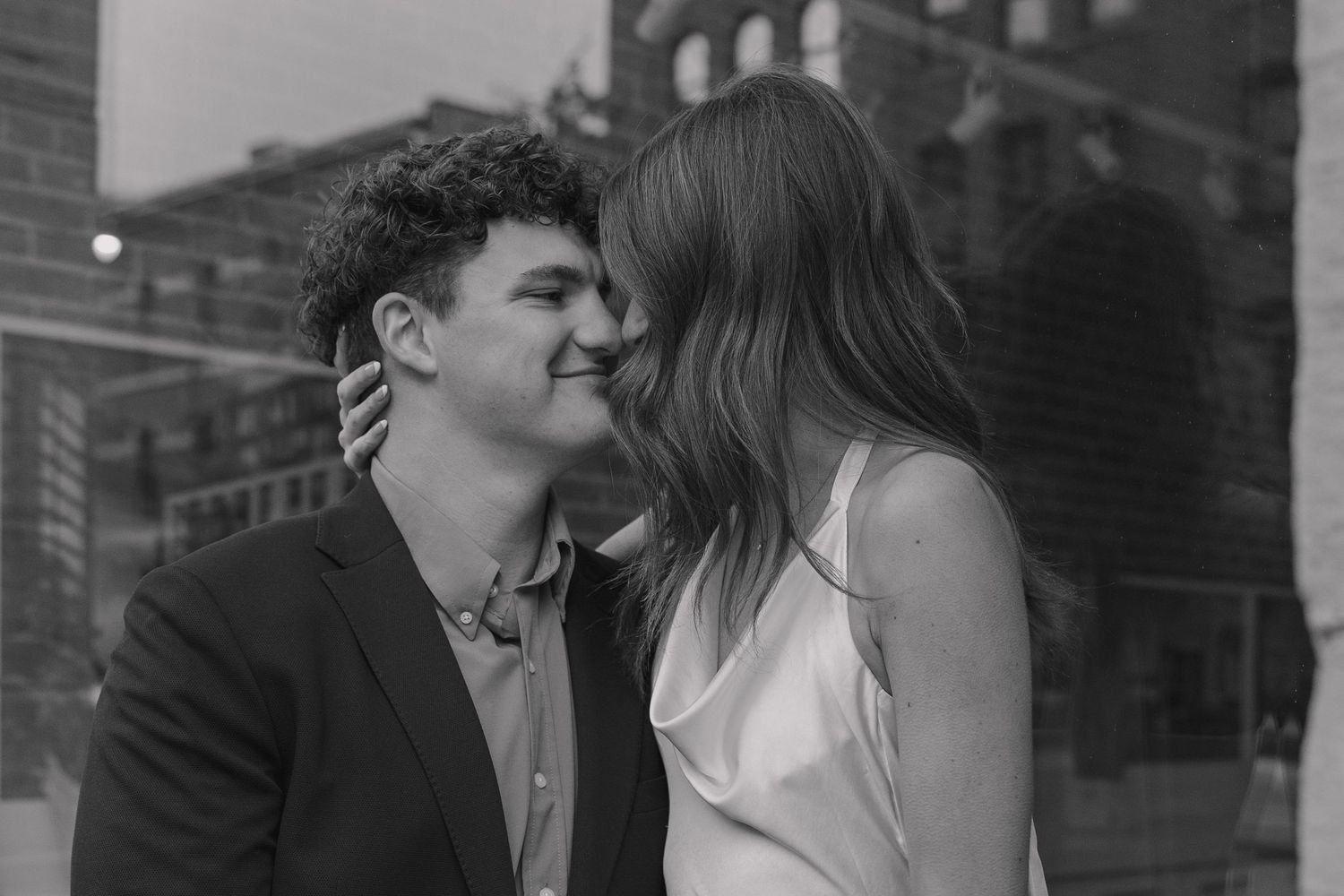 Engagement session in downtown Denver near Union Station with real, unscripted moments and soft directional light