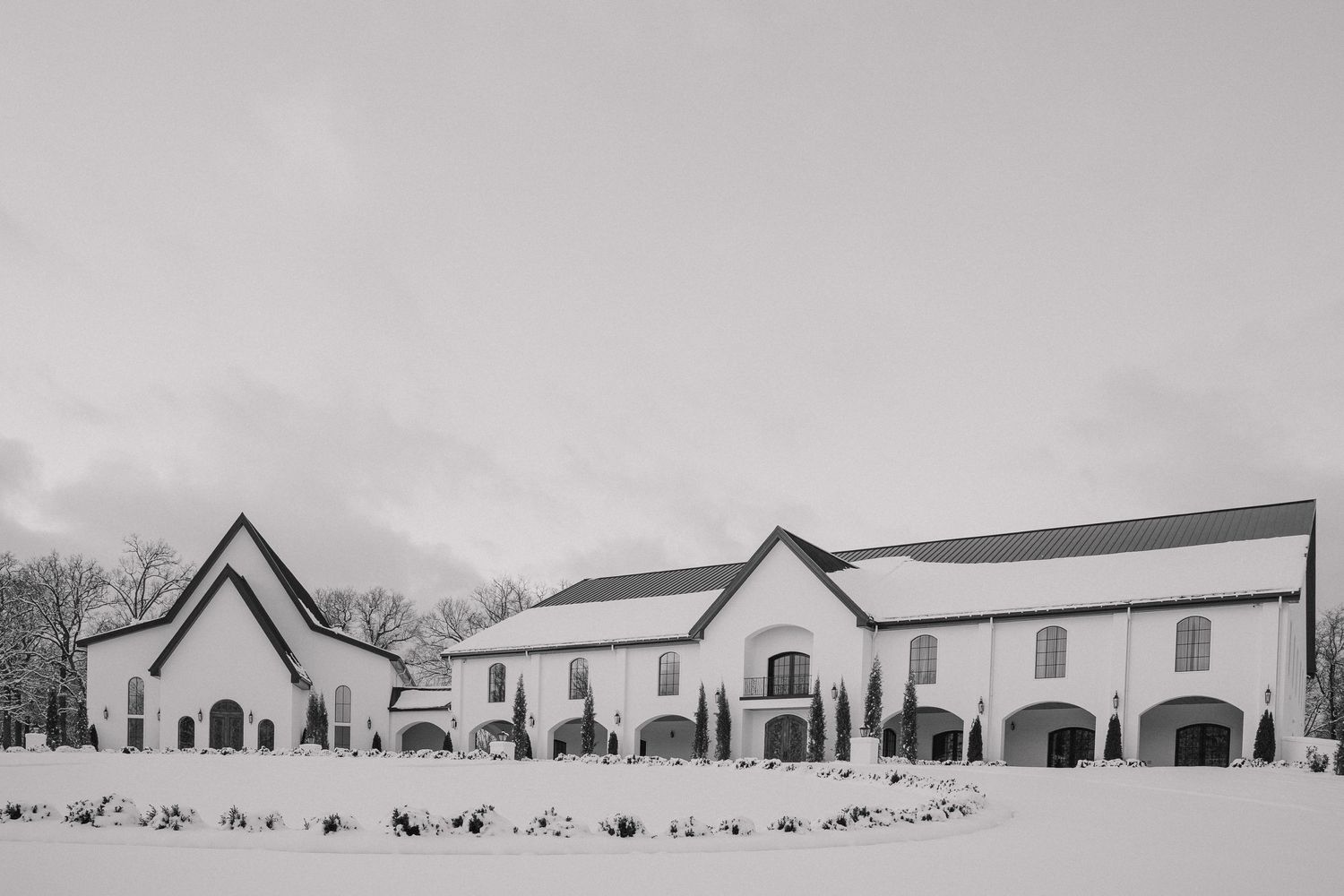 Black and White photo of The Grand at Willow Springs wedding venue located in NWA on a snowy day  by Malachi Westbrook Photography.