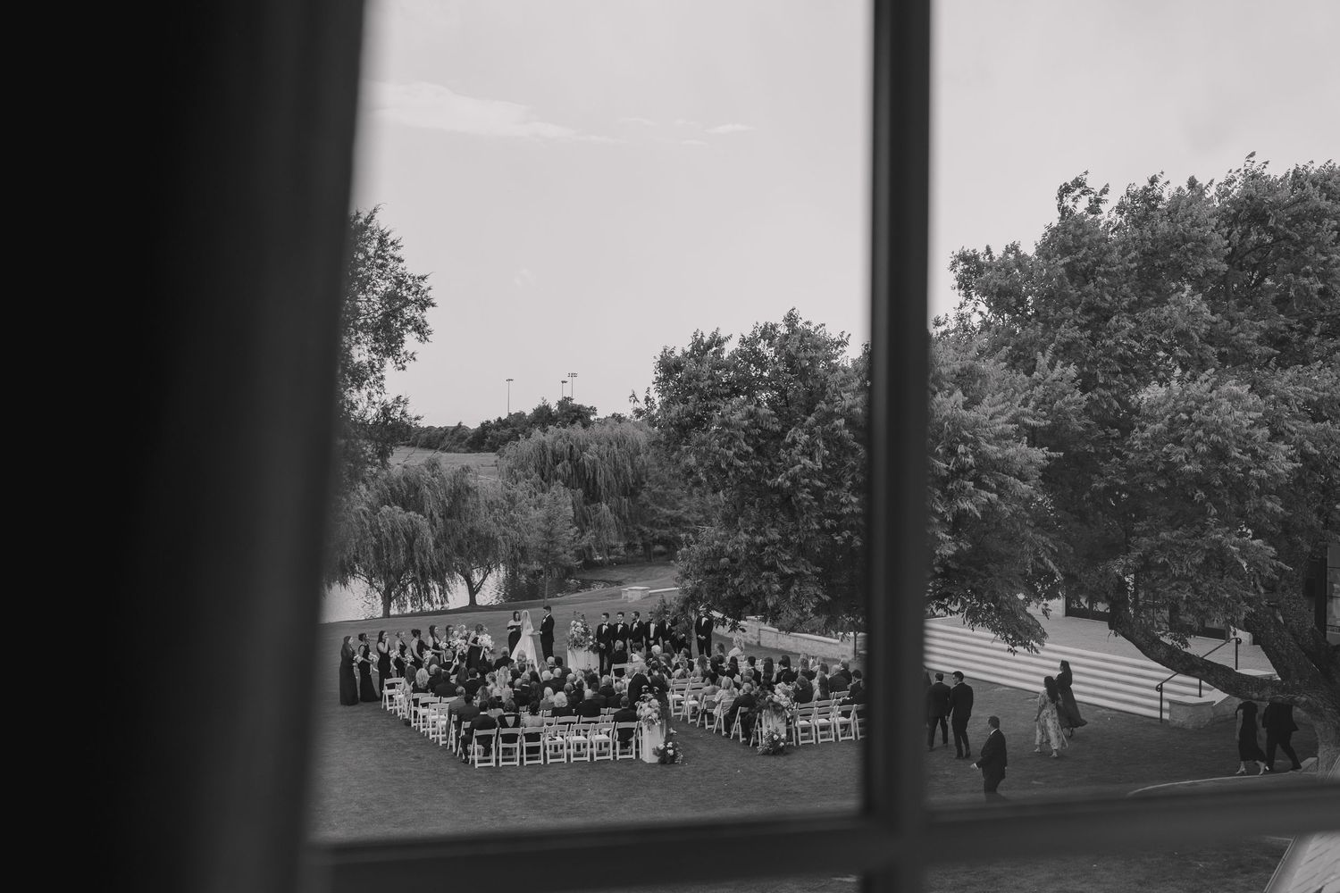 Documentary style black and white photo taken of wedding ceremony at the bower.